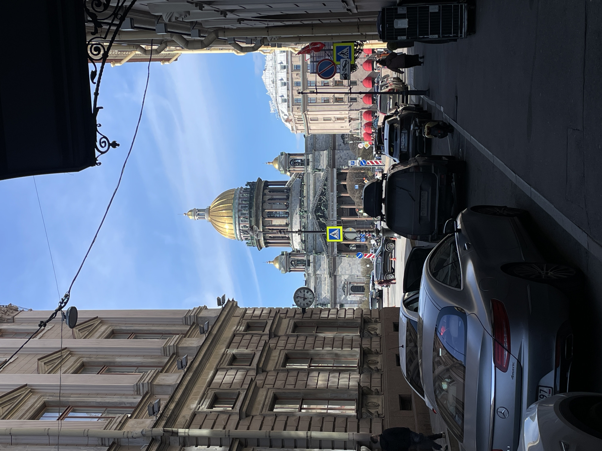 Tourist poses for photos near St. Isaac's Cathedral, Saint Petersburg