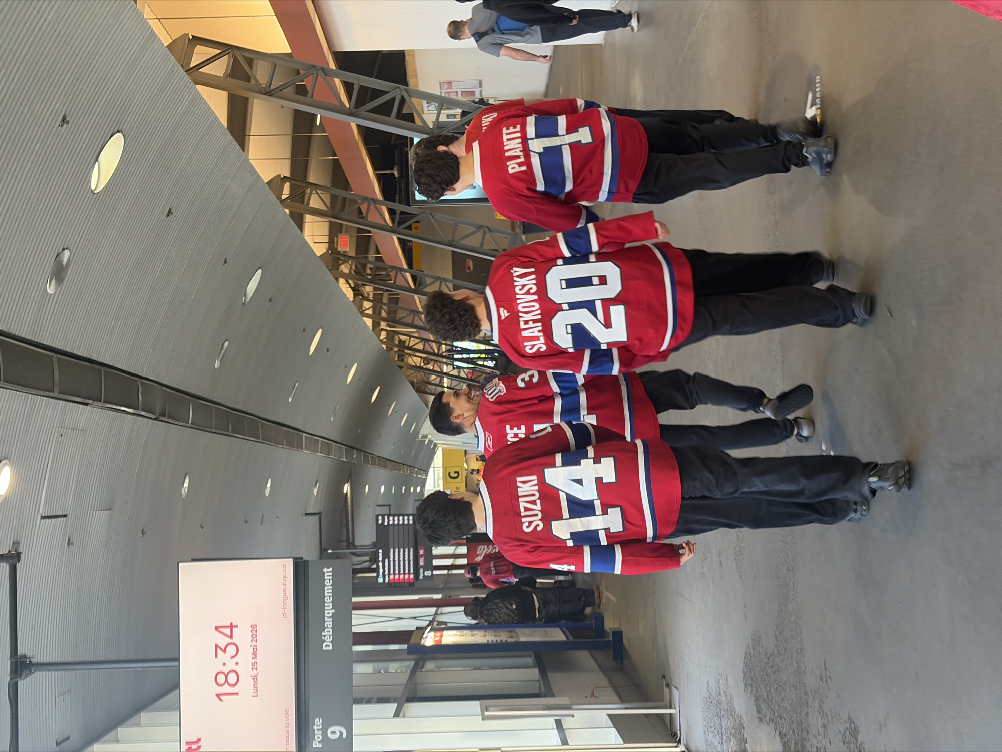 Canadiens fans in matching Suzuki jerseys spotted at Longueuil Metro