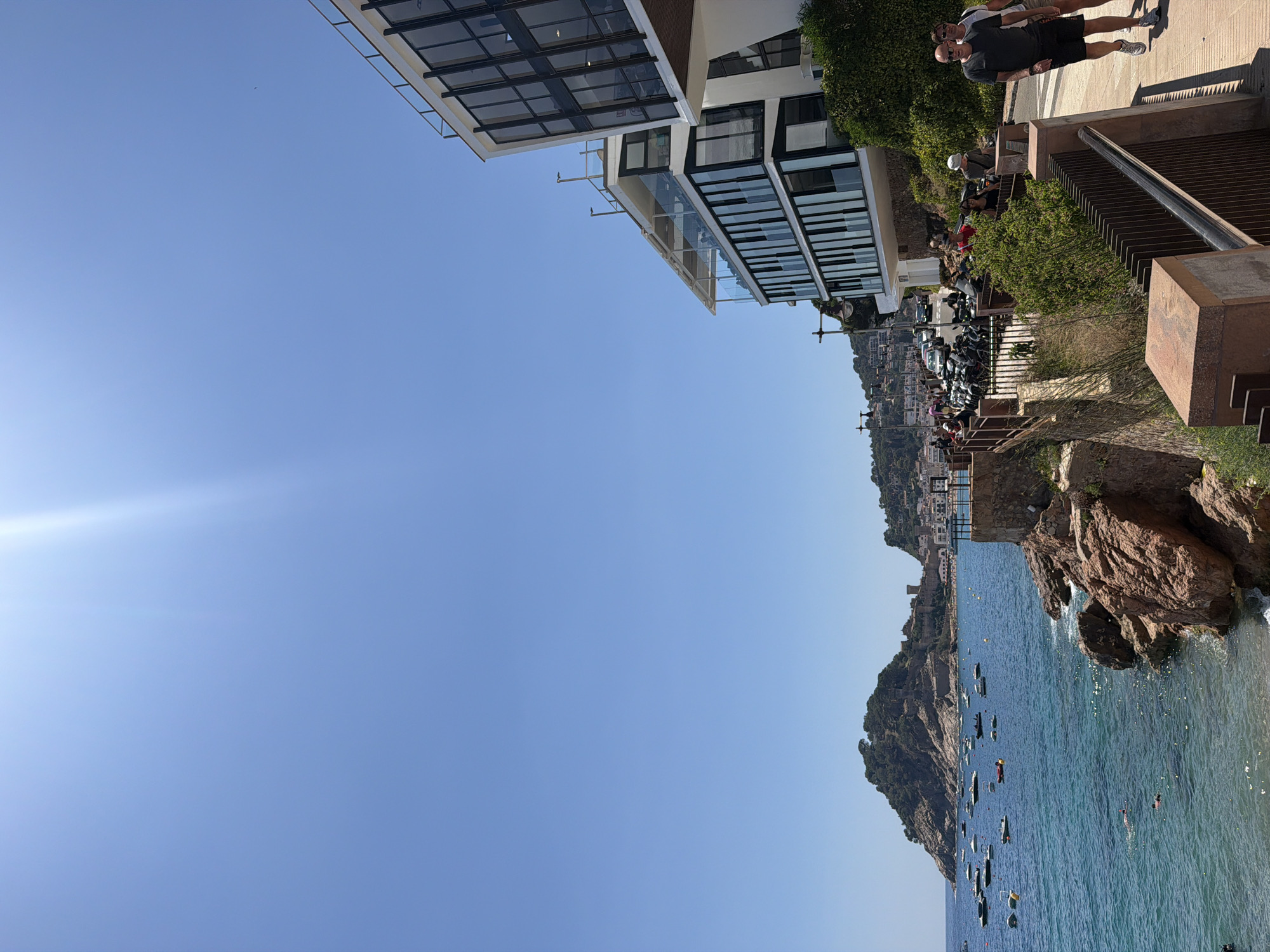 Selfies and sea views at a boat-filled coastal bay