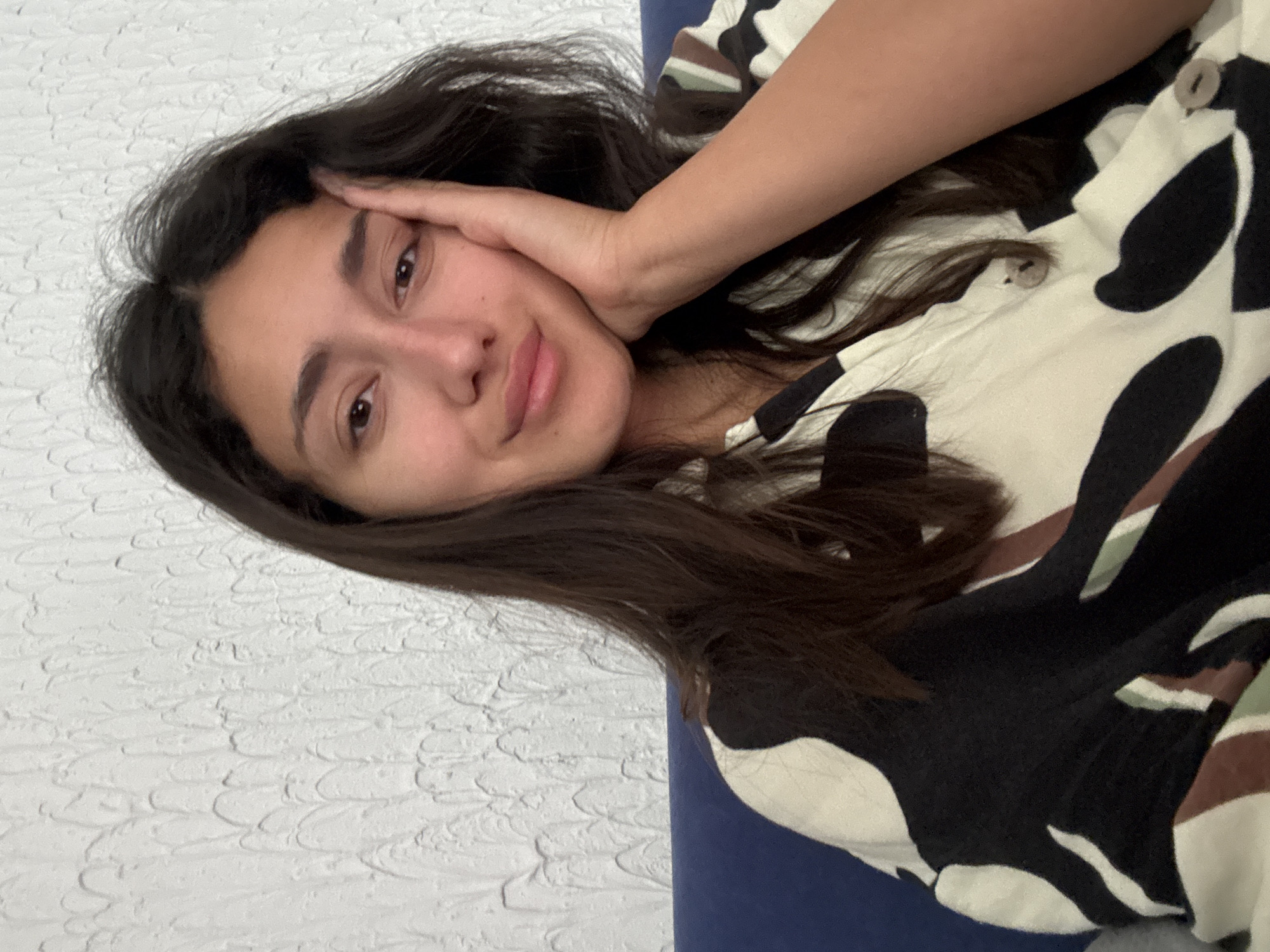 Woman takes indoor selfie portrait in Sutomore, Montenegro