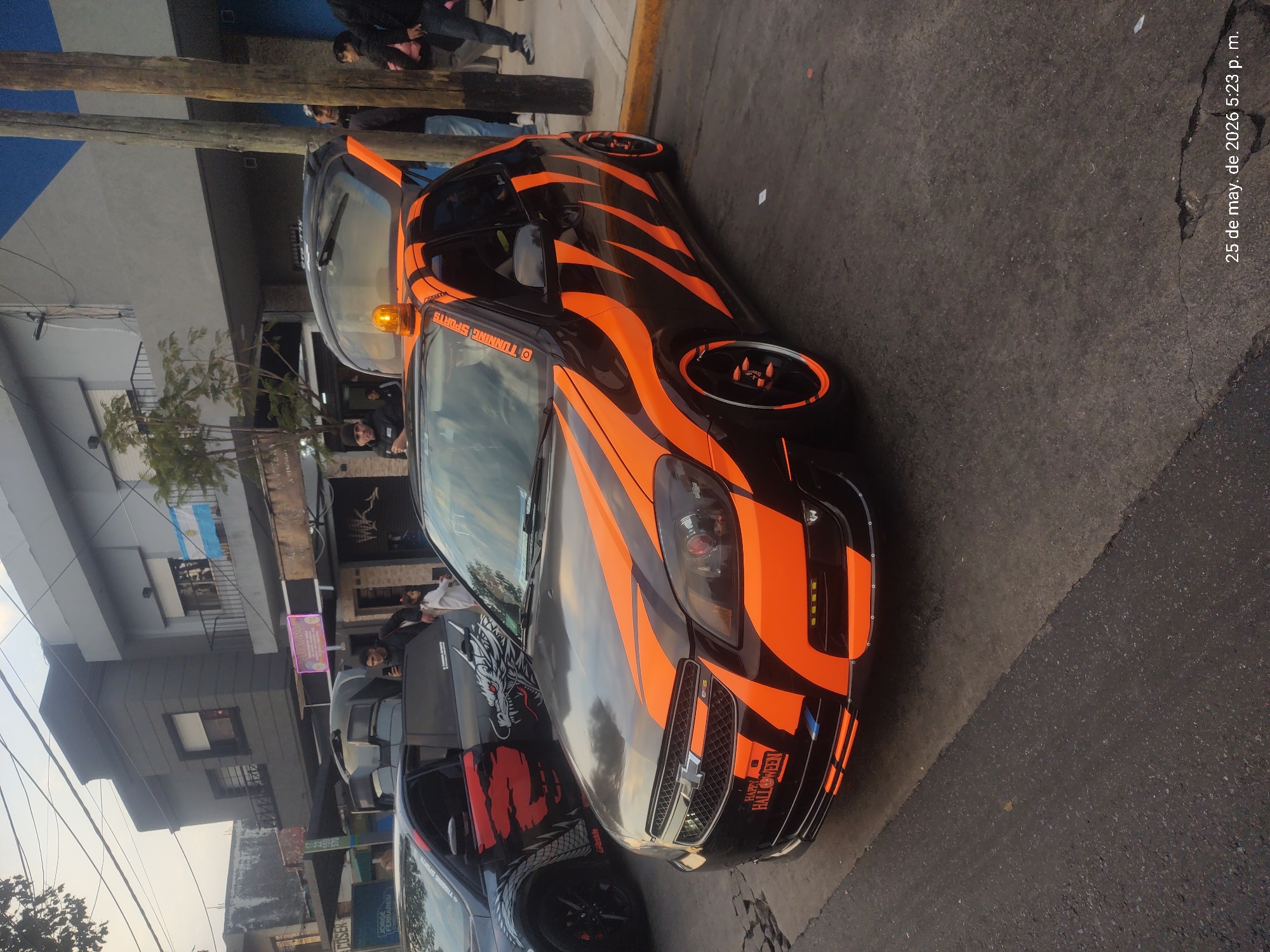 Decorated custom cars gather on Wilde Argentina streets