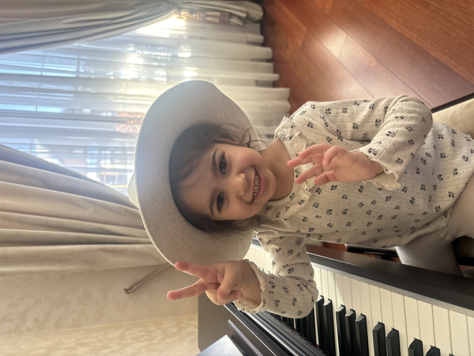 Young girl enjoys piano practice and snow play in Russian village