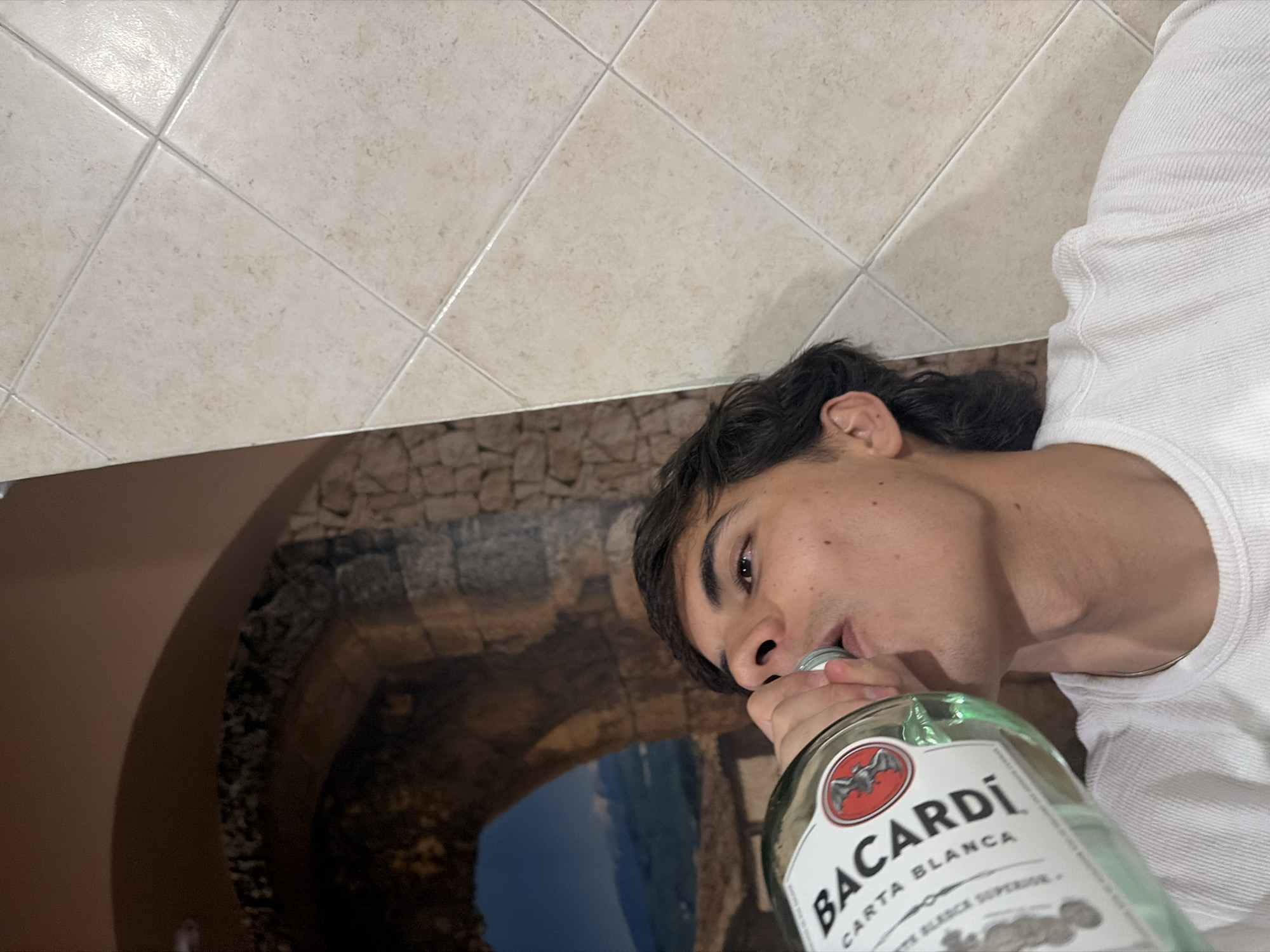 Man drinks and socializes at dawn gathering in Cholula