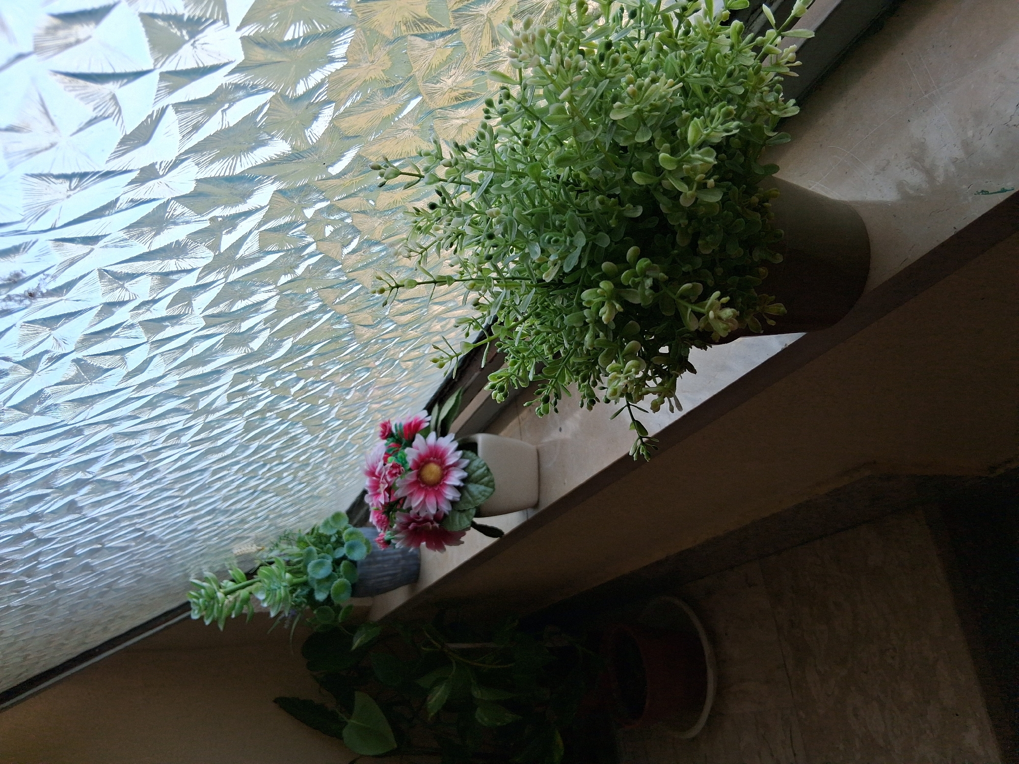 Inside a Colorno residence: staircases, doors, and windowsill plants