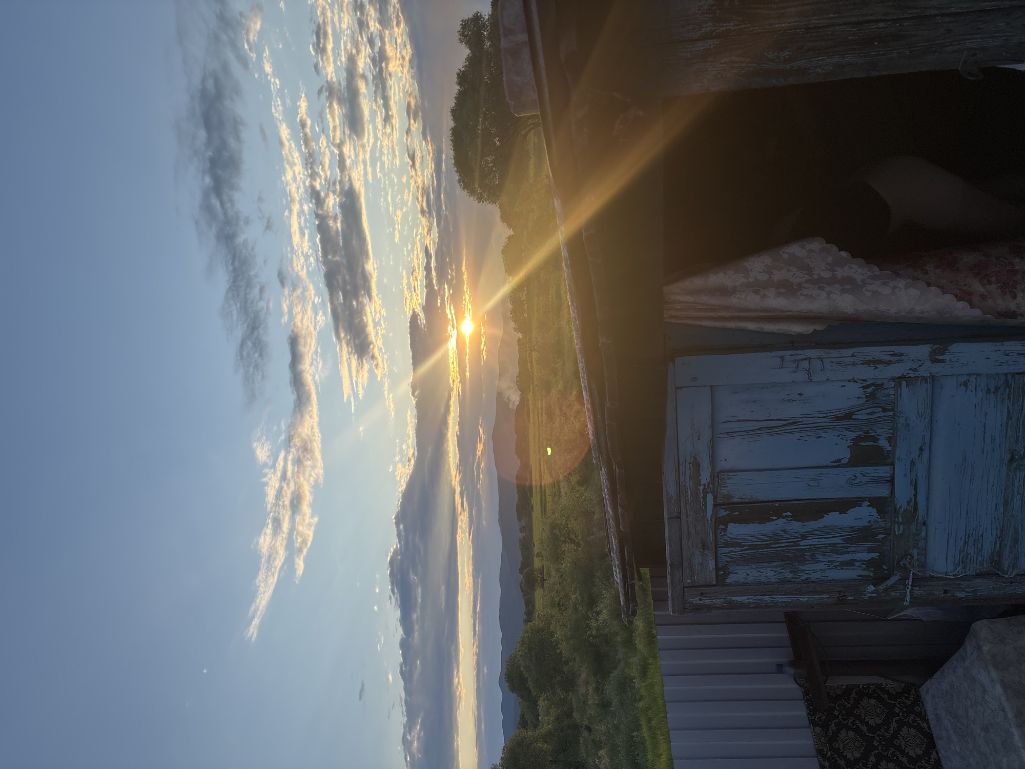 Rural scenes: resting dog, bus travel, sunset landscapes documented