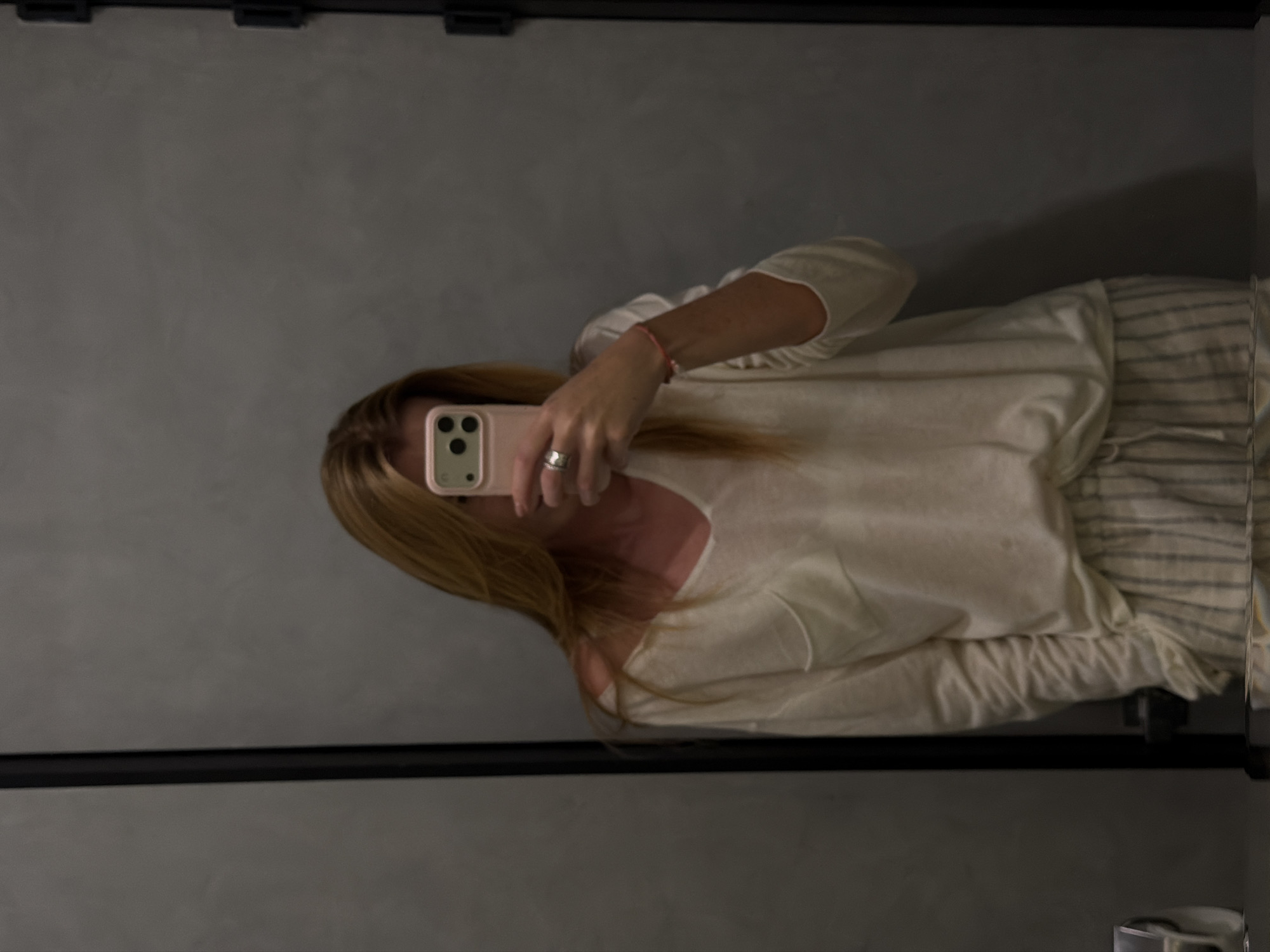 Woman takes mirror selfies at Bishkek restaurant