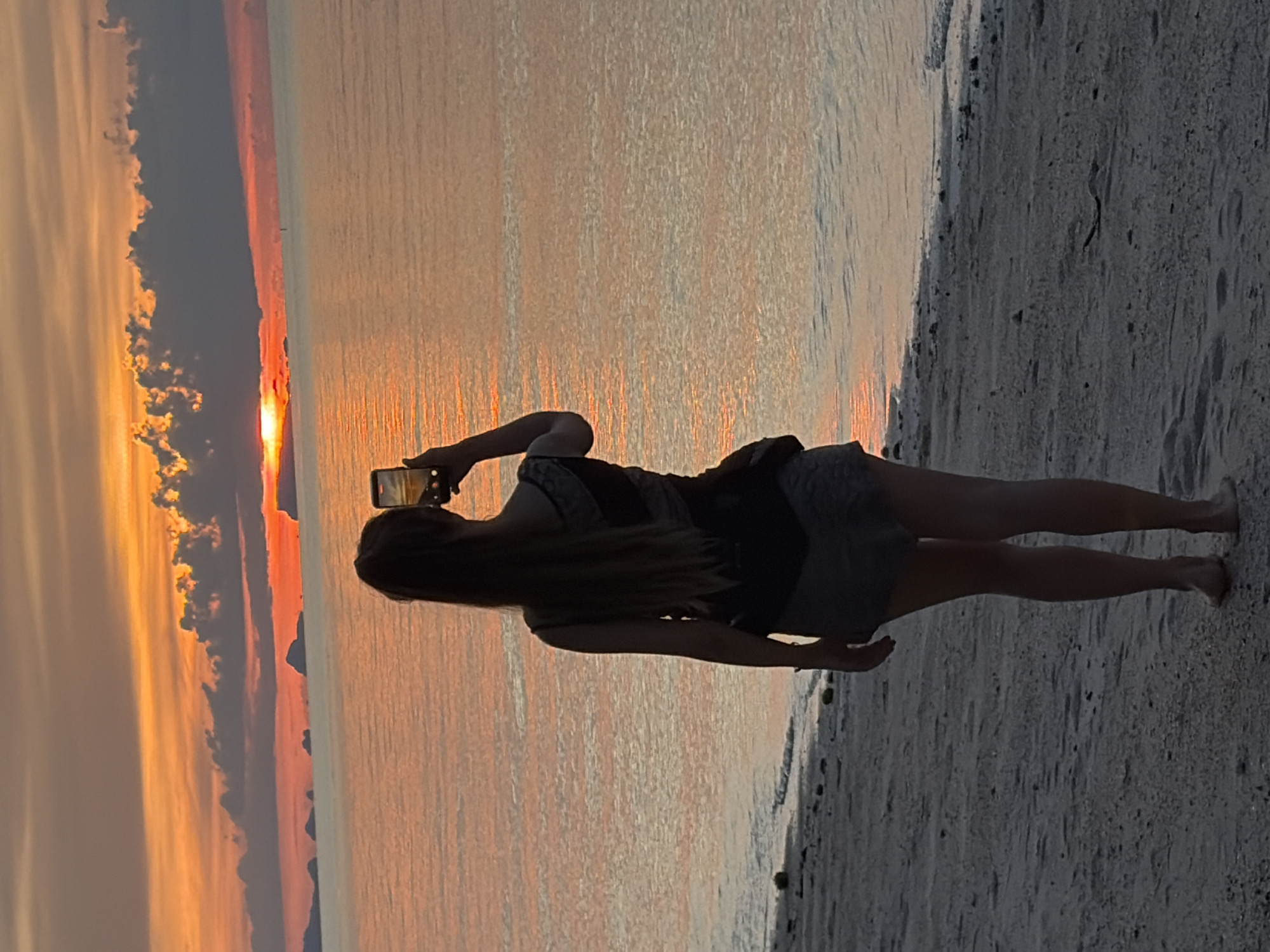 Sunset hour on a Koh Samui beach — fishing, dogs, and golden light