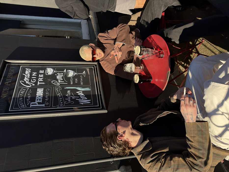 Men gather for afternoon drinks at London pub