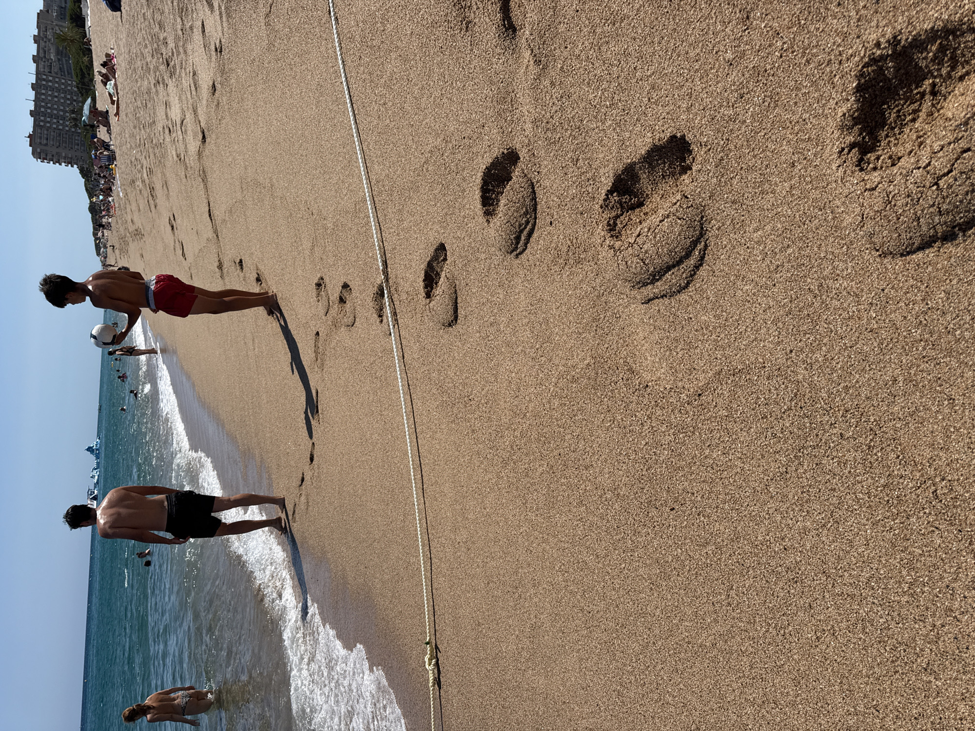 A summer afternoon across Blanes beach and its boardwalk