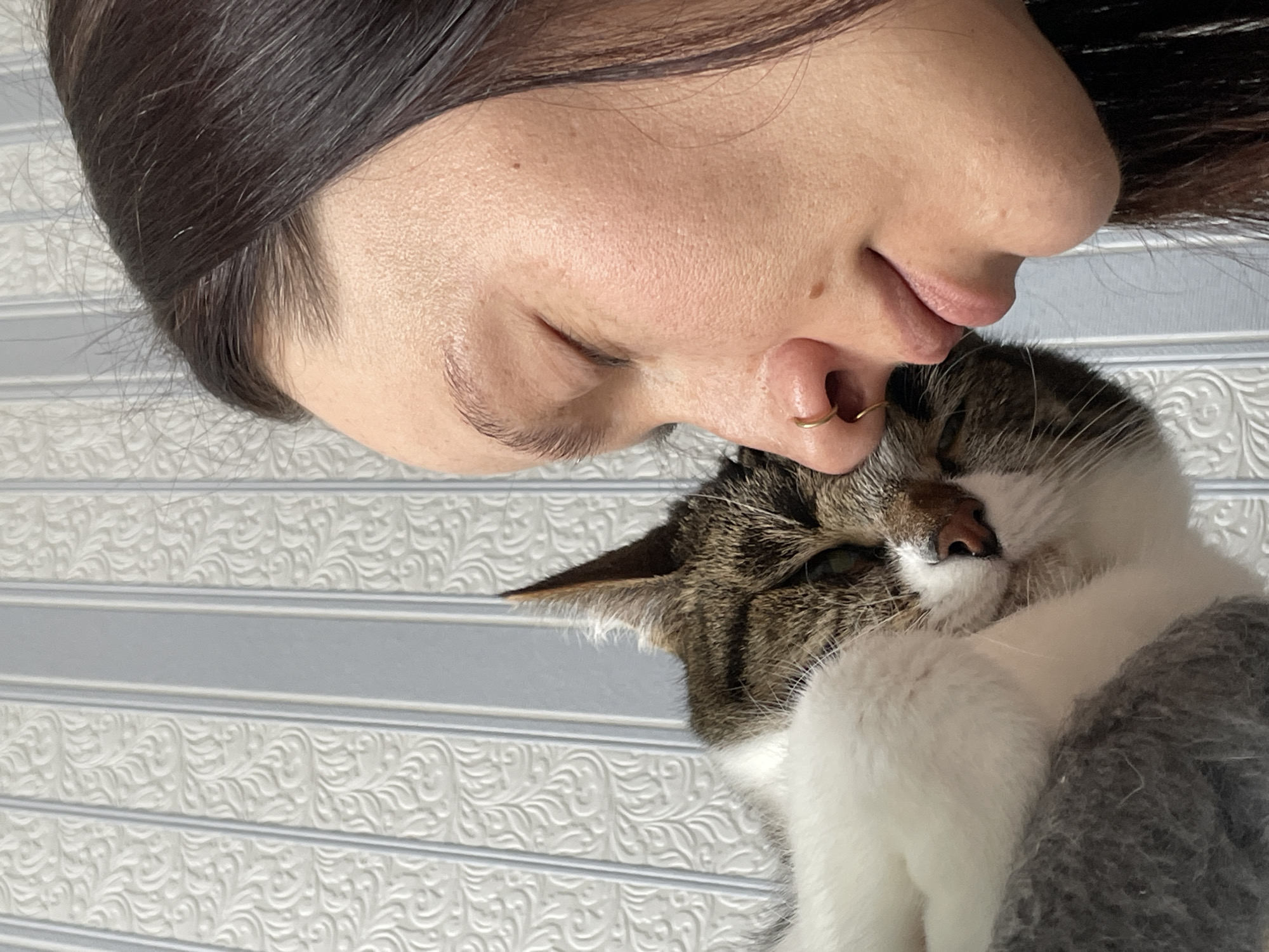 Woman and cat share quiet moment in Izhevsk