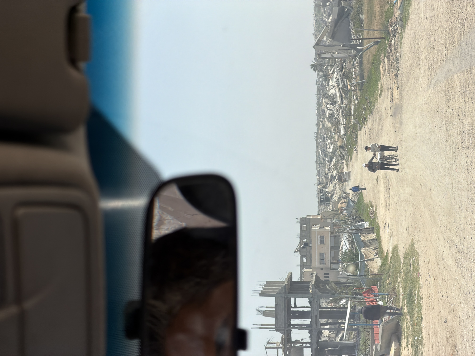 Vehicle interior view captured on Khan Yunis road
