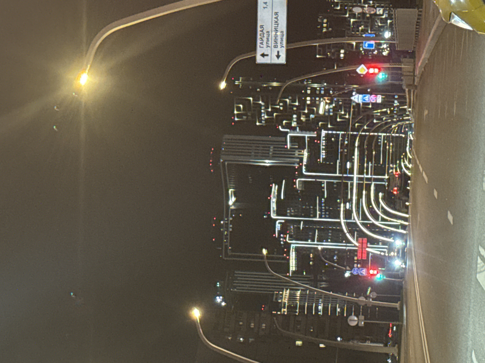 Moscow nighttime cityscape documented from moving vehicle