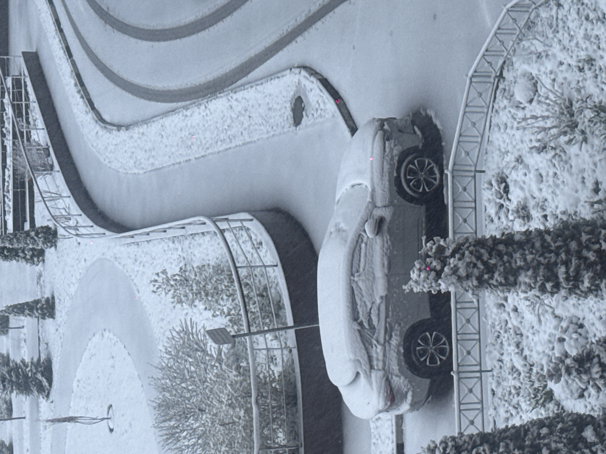 Heavy spring snowfall blankets Khimki, Russia streets and buildings