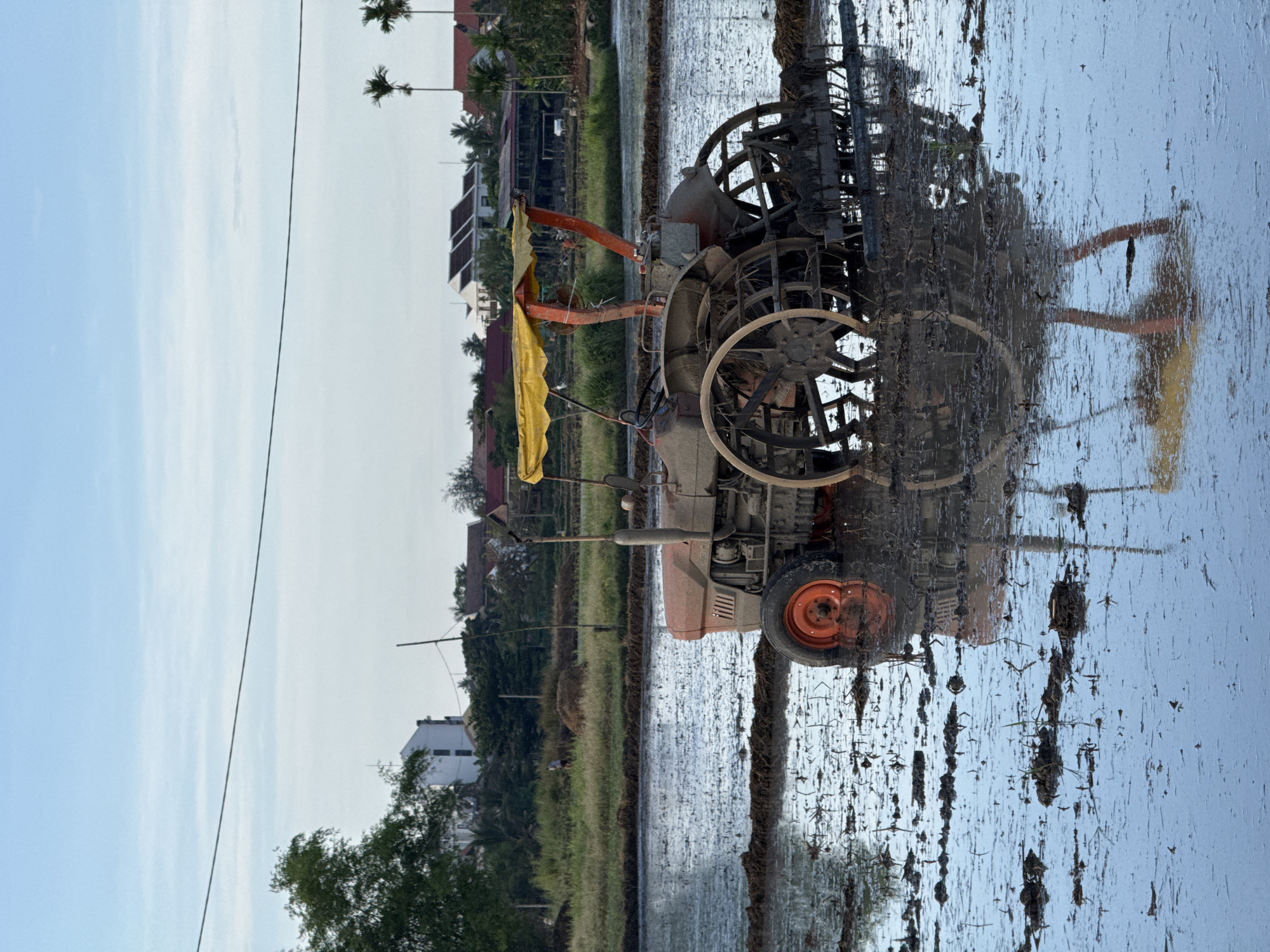 Tractor stuck in flooded rice paddy in Đà Nẵng