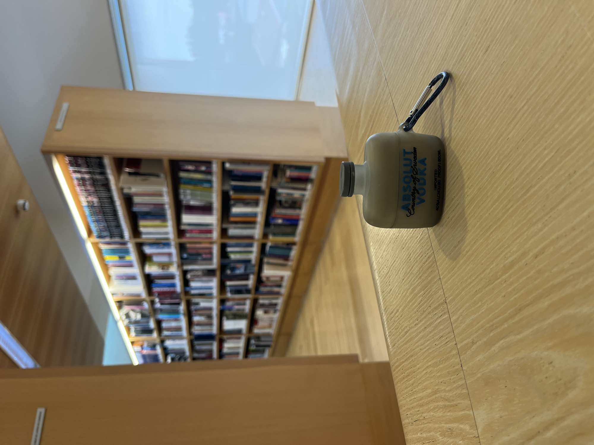 Branded AirPod case spotted in Portuguese library setting