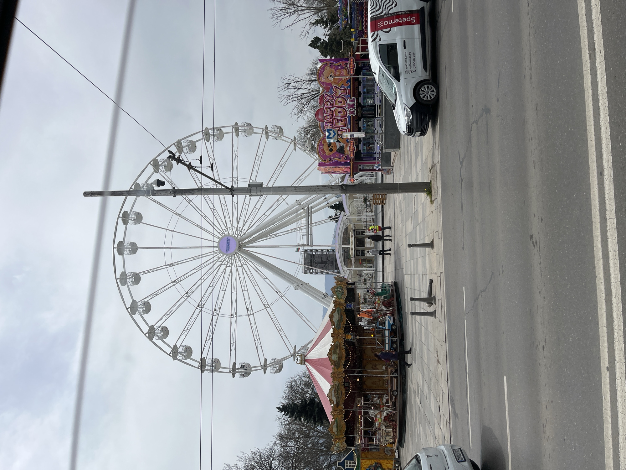 Carnival rides spotted alongside roadway with parked van