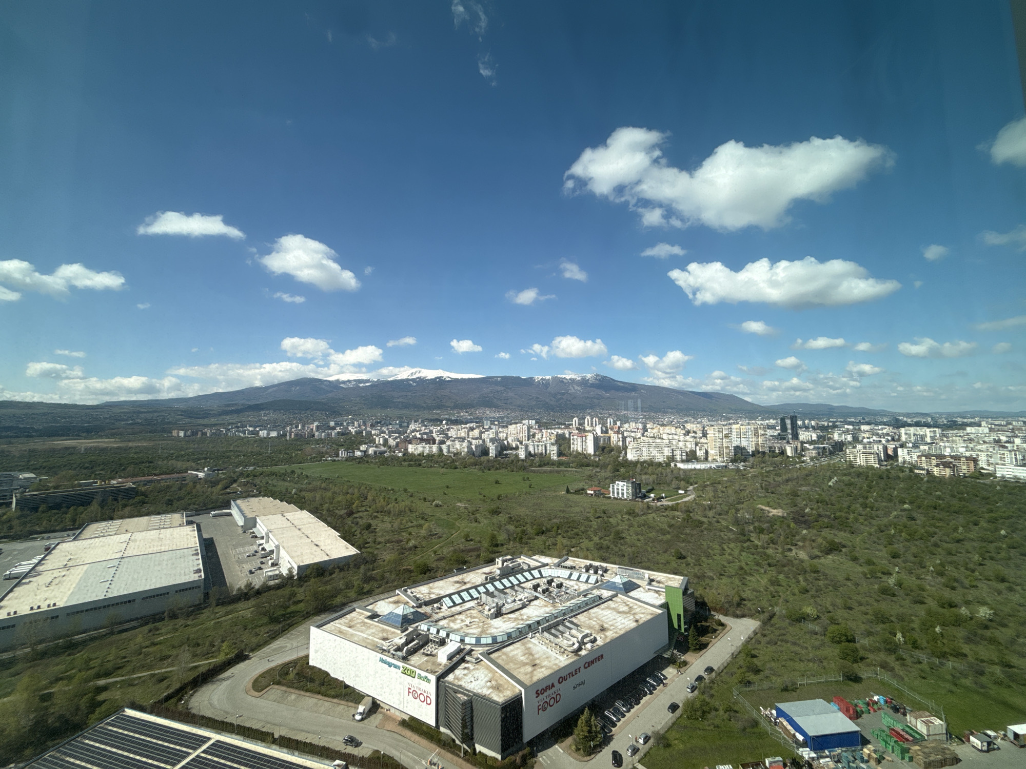 Sofia cityscape photographed with snow-capped mountains backdrop