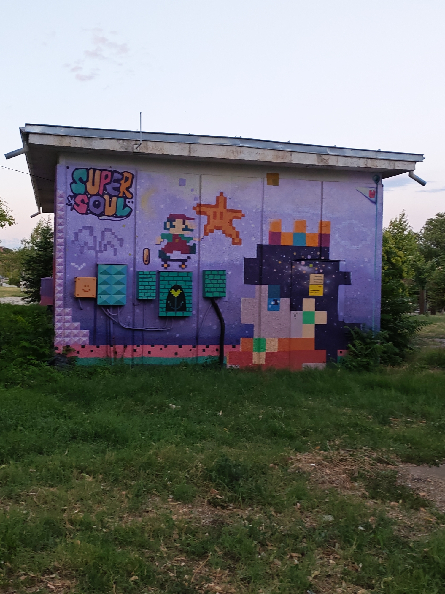 Street murals in Stara Zagora span retro gaming and cosmic themes