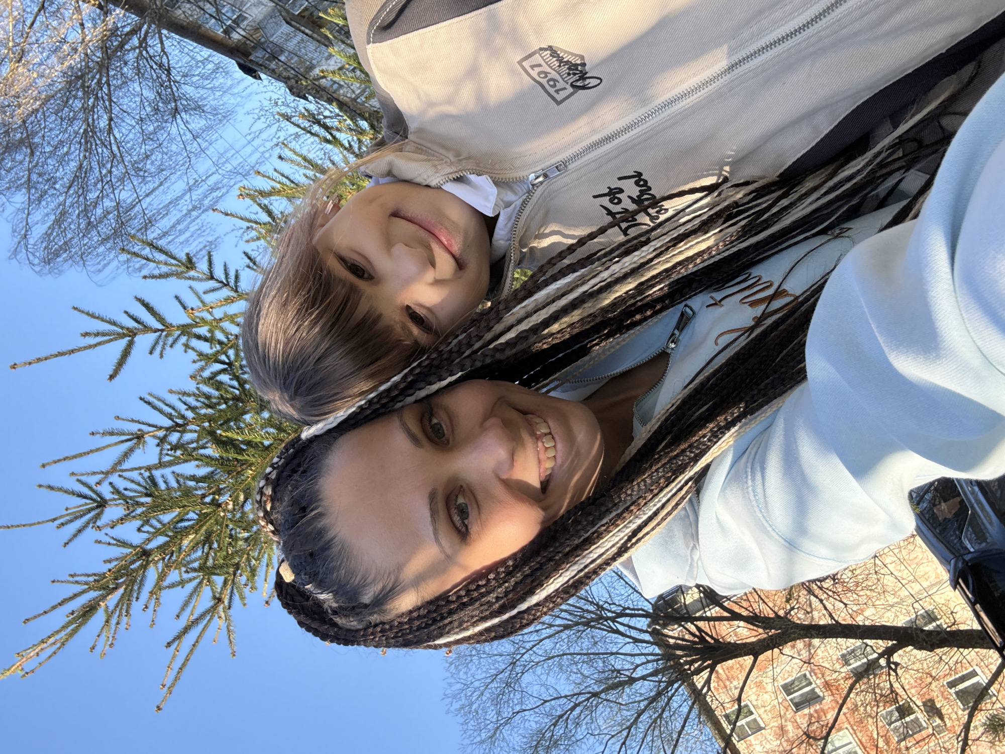 Woman and child enjoy sunny afternoon selfies in Rusanovo