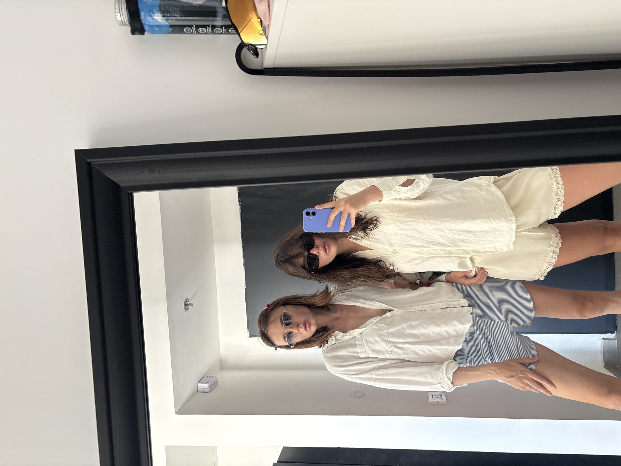 Women take mirror selfies in Tel-Aviv apartment