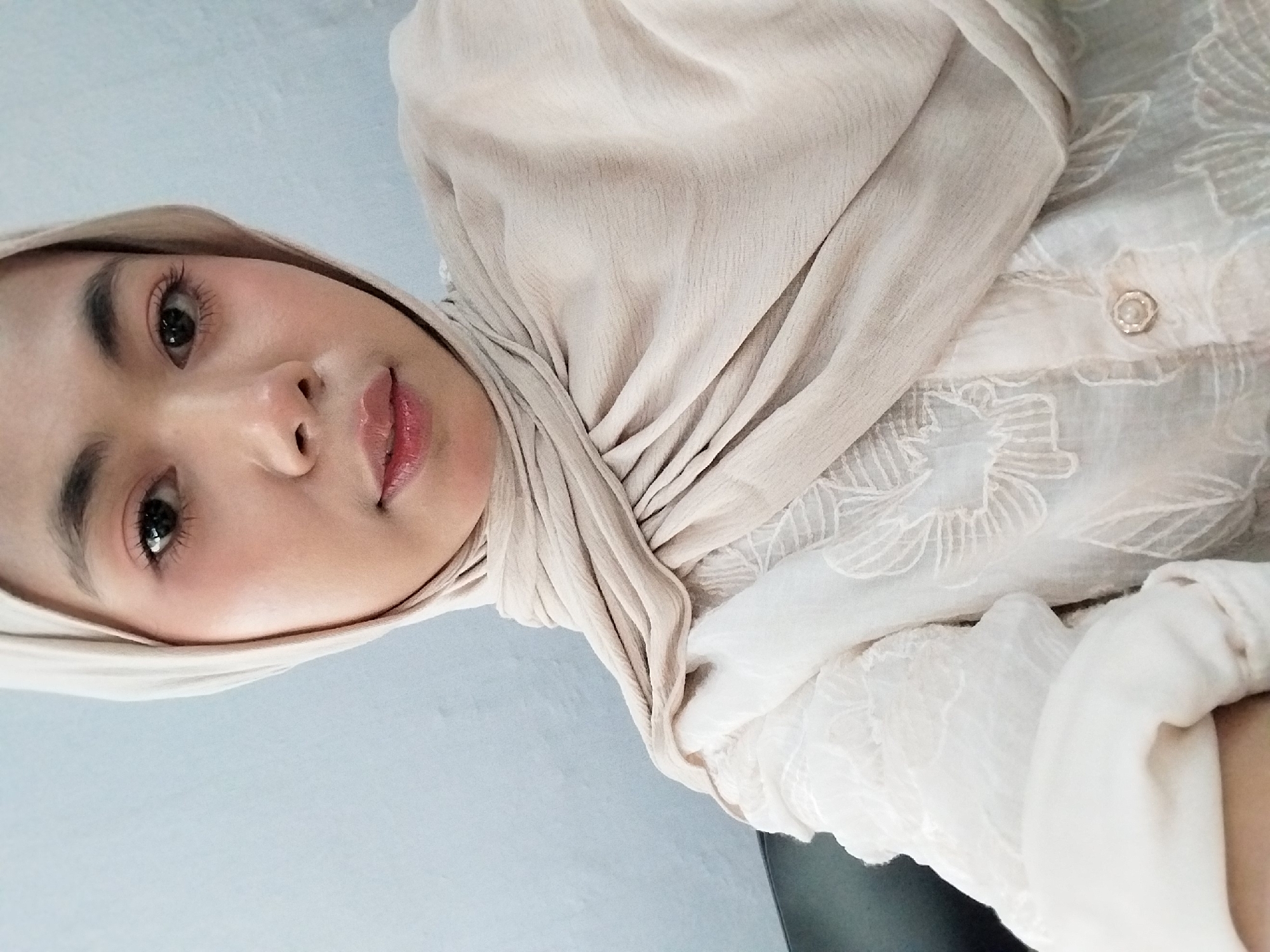 Selfie session against a light blue wall in Tibojong
