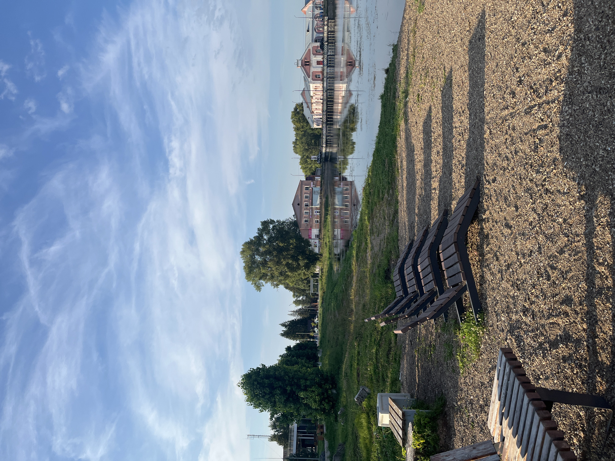 Quiet lakeside park with paddle boats and benches, Ufa