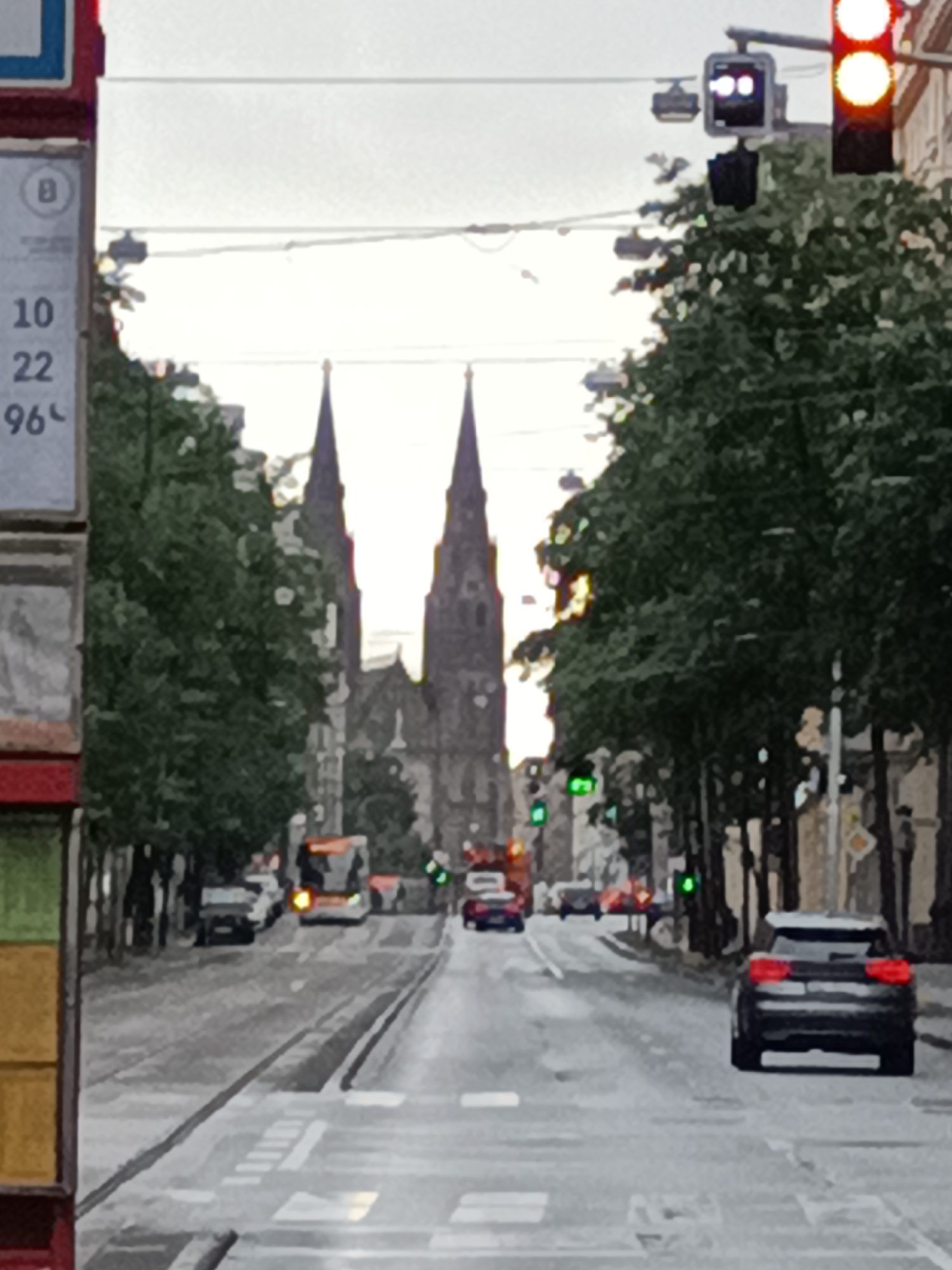 Overcast morning on Prague's tram streets, spires in the background