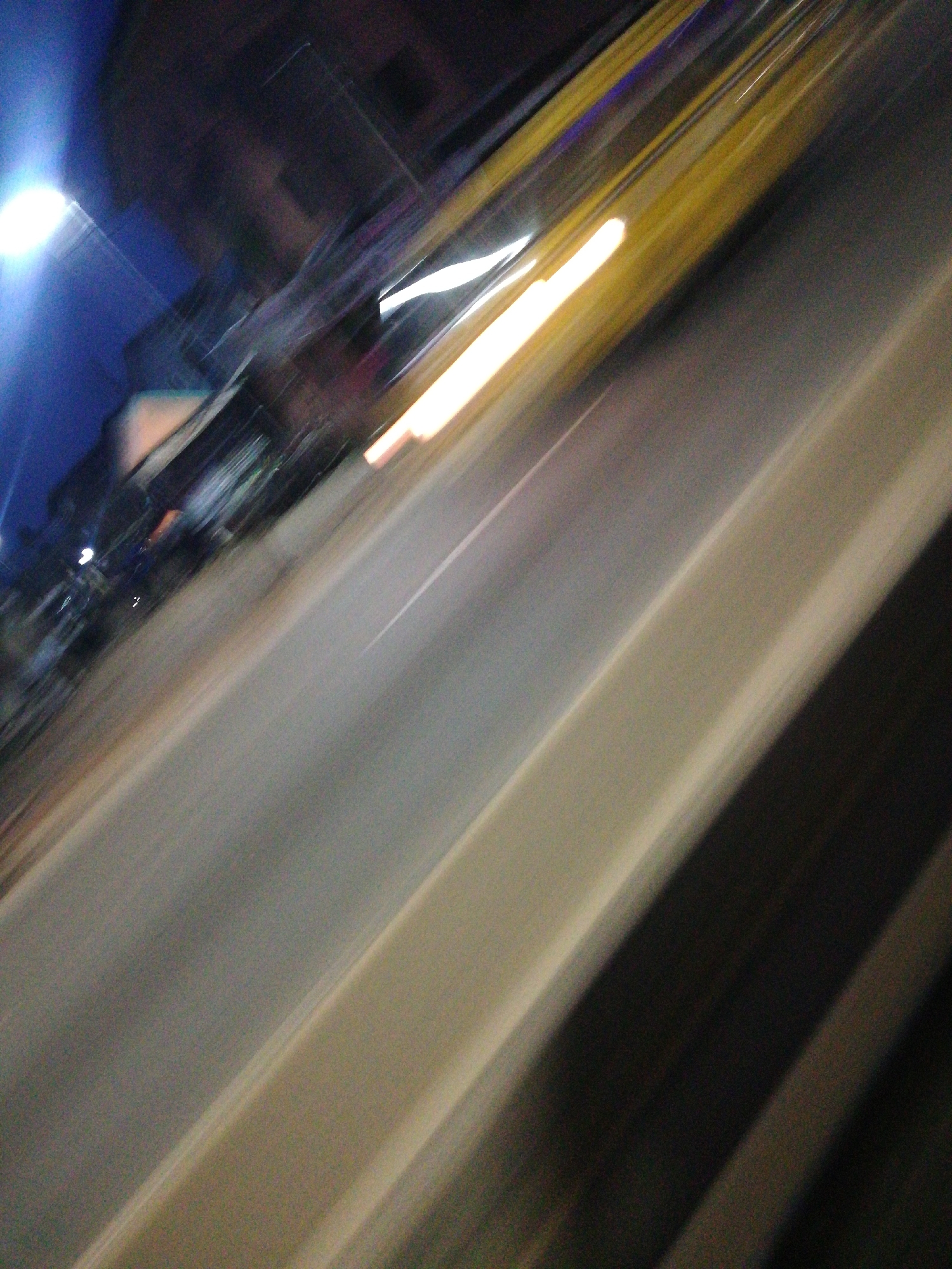 Evening traffic captured in motion-blurred Lagos street scenes