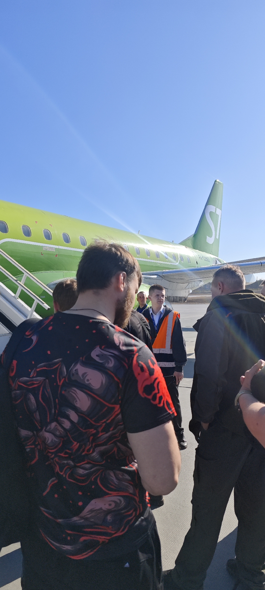 Passengers board S7 Airlines flight at Talakan Airport