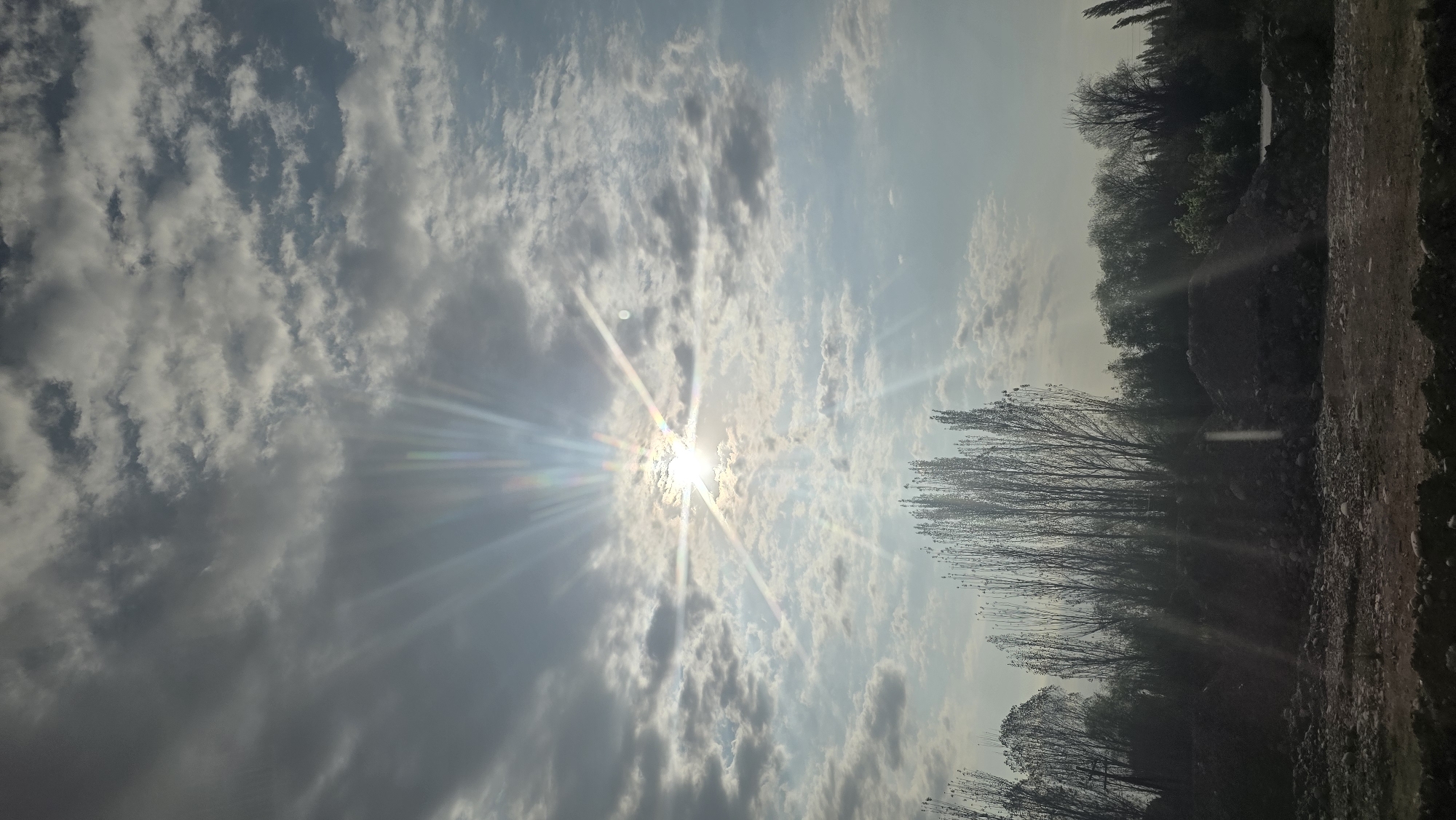 Sunbeams break through clouds over Nariman, Kyrgyzstan