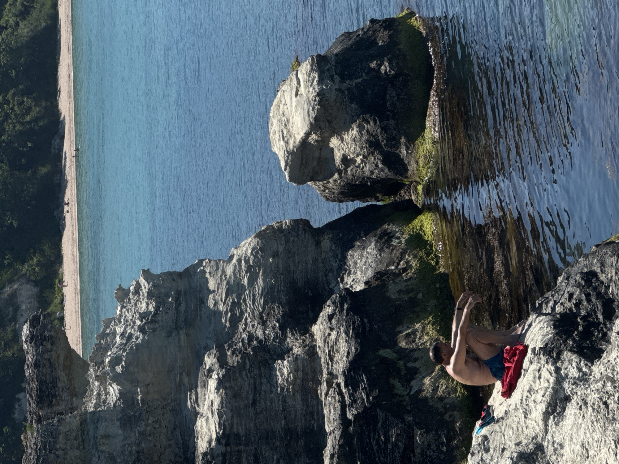 Beach day captured along Tsarevo's rocky Black Sea coastline