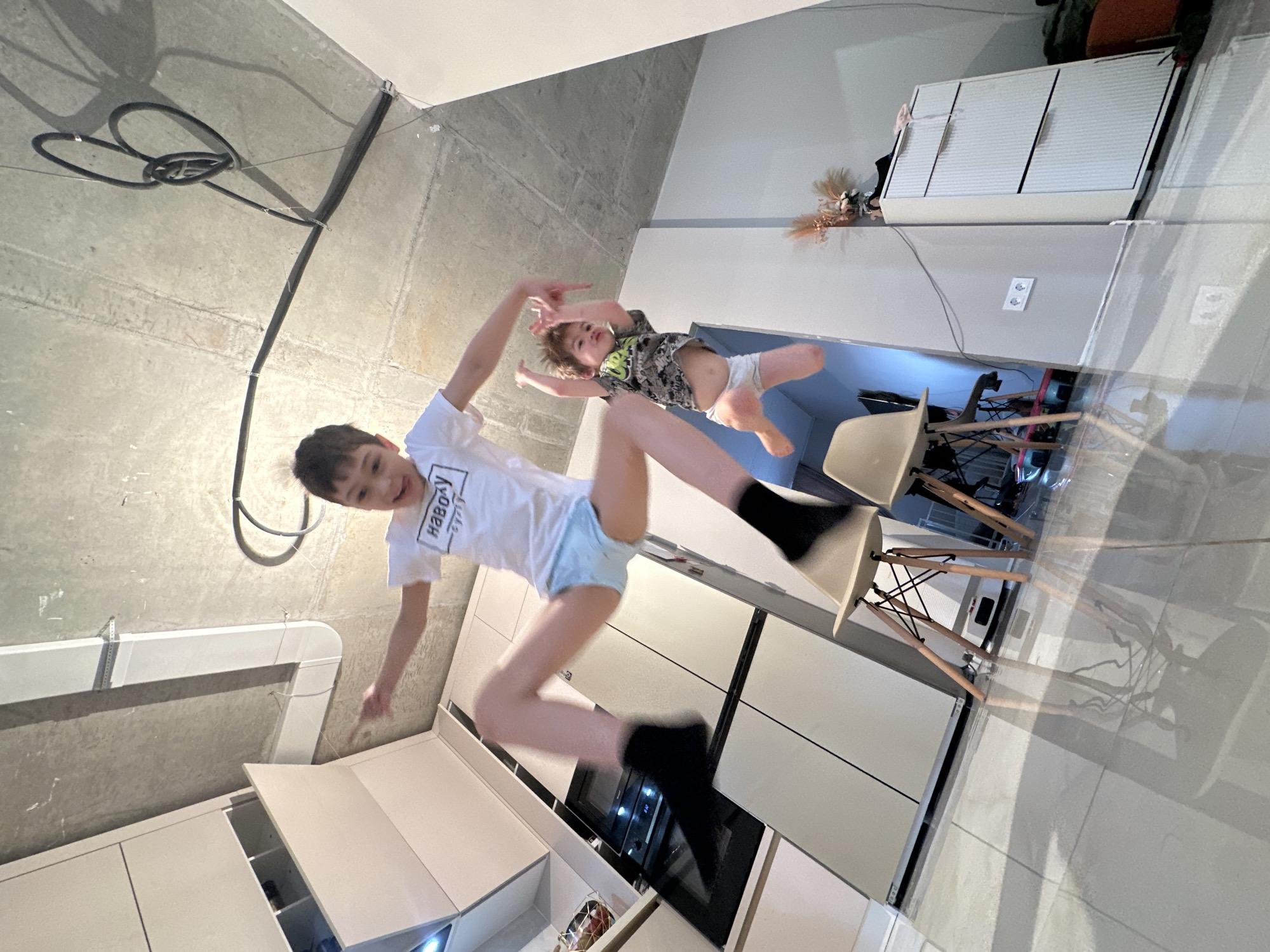 Boys captured mid-jump in rotated photo in Moscow