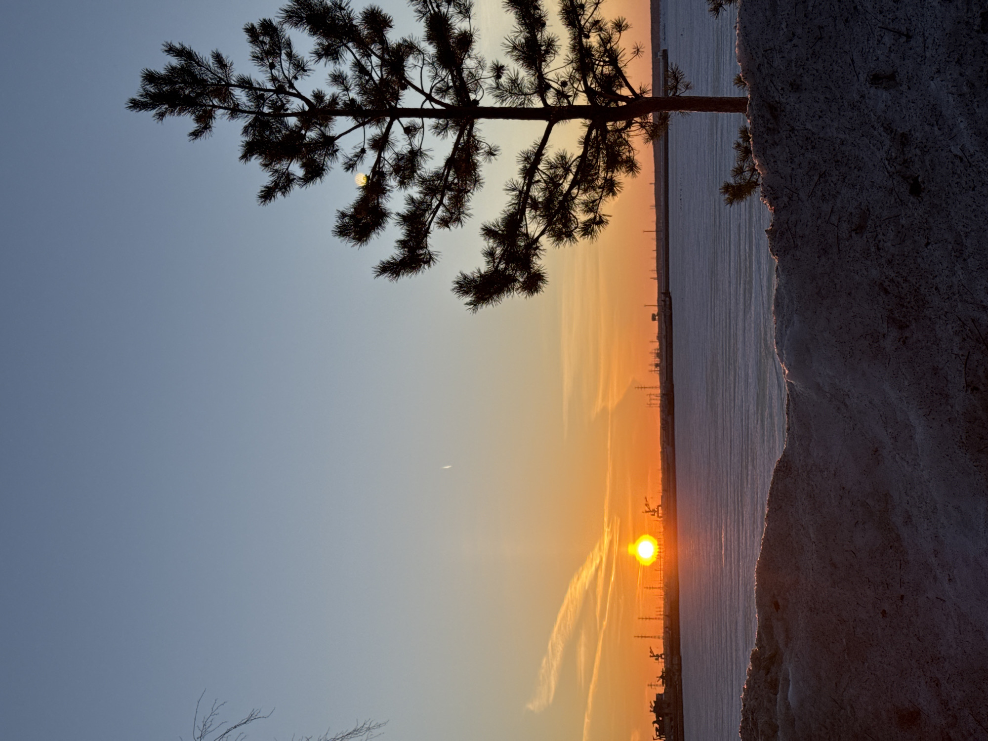 Winter sunset documented across Chaikovsky, Russia industrial waterfront areas
