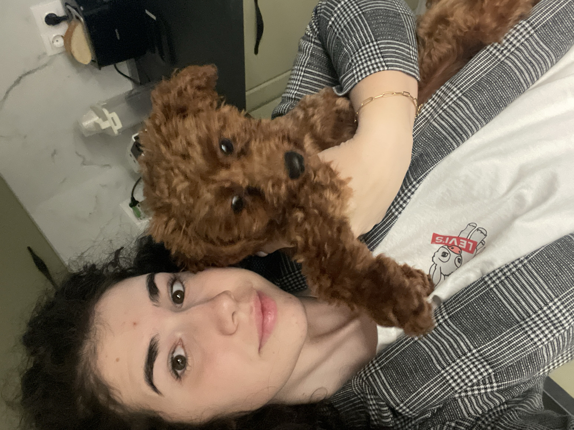 Woman and brown poodle share quiet moments in Sofia