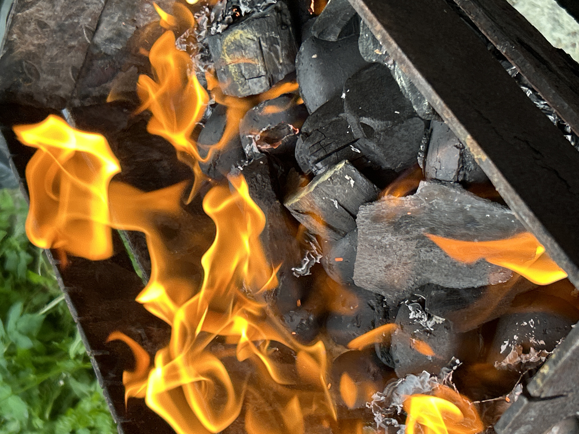 Afternoon barbecue session documented in Tallinn with burning charcoal