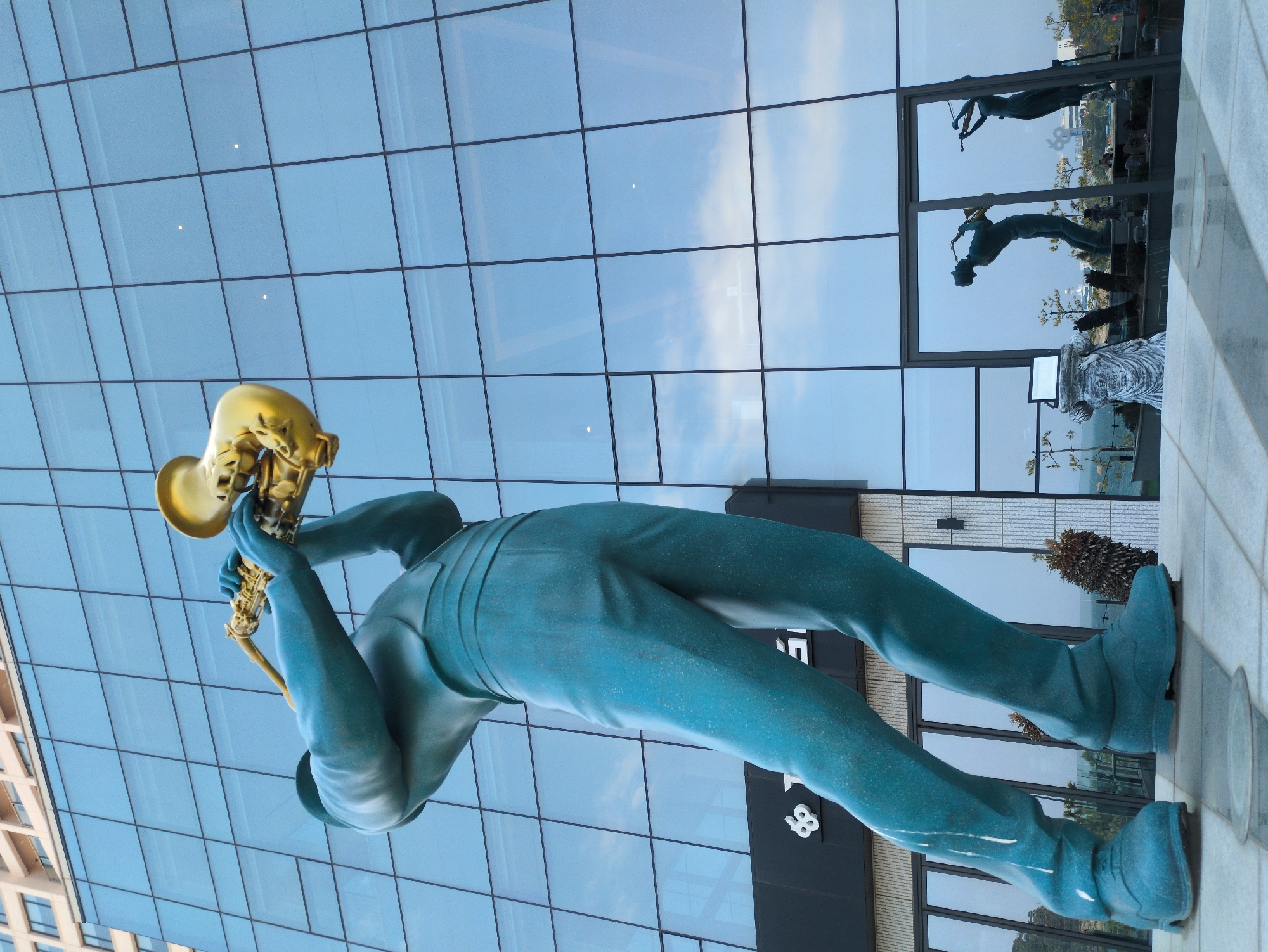 Ulsan visitor documents musician statues and beach construction scenes