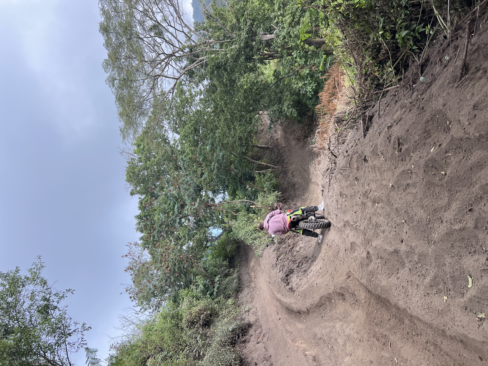 Dirt biking through lush, overgrown hills in Kubu, Bali