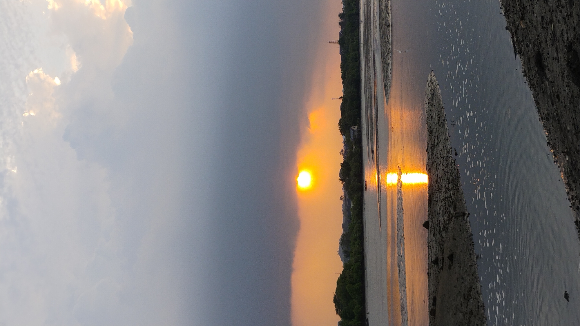 Dramatic sunset over Lhokseumawe's coastal waters, multiple angles