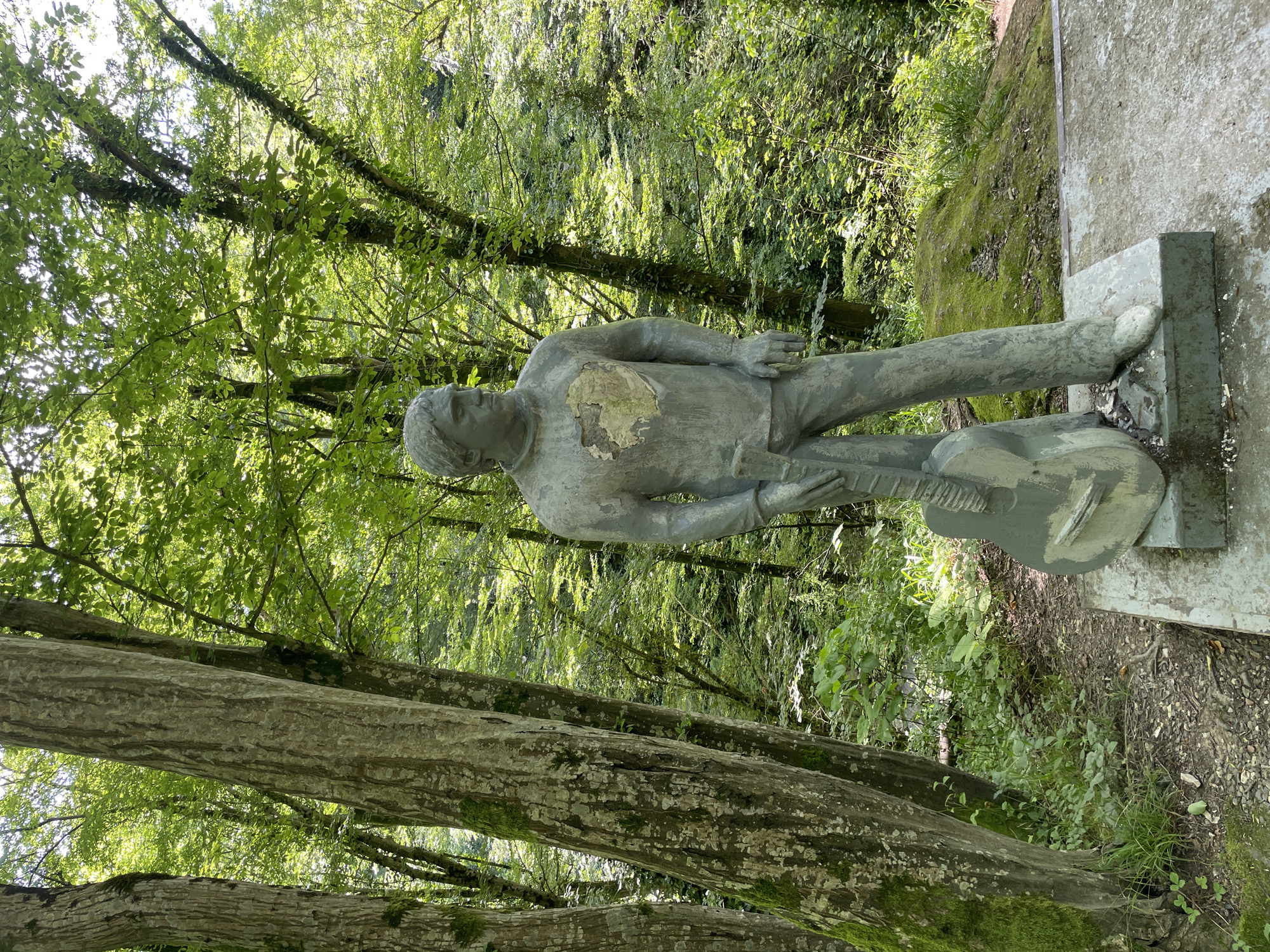 Family explores forest statue memorial in Khostinskiy, Russia