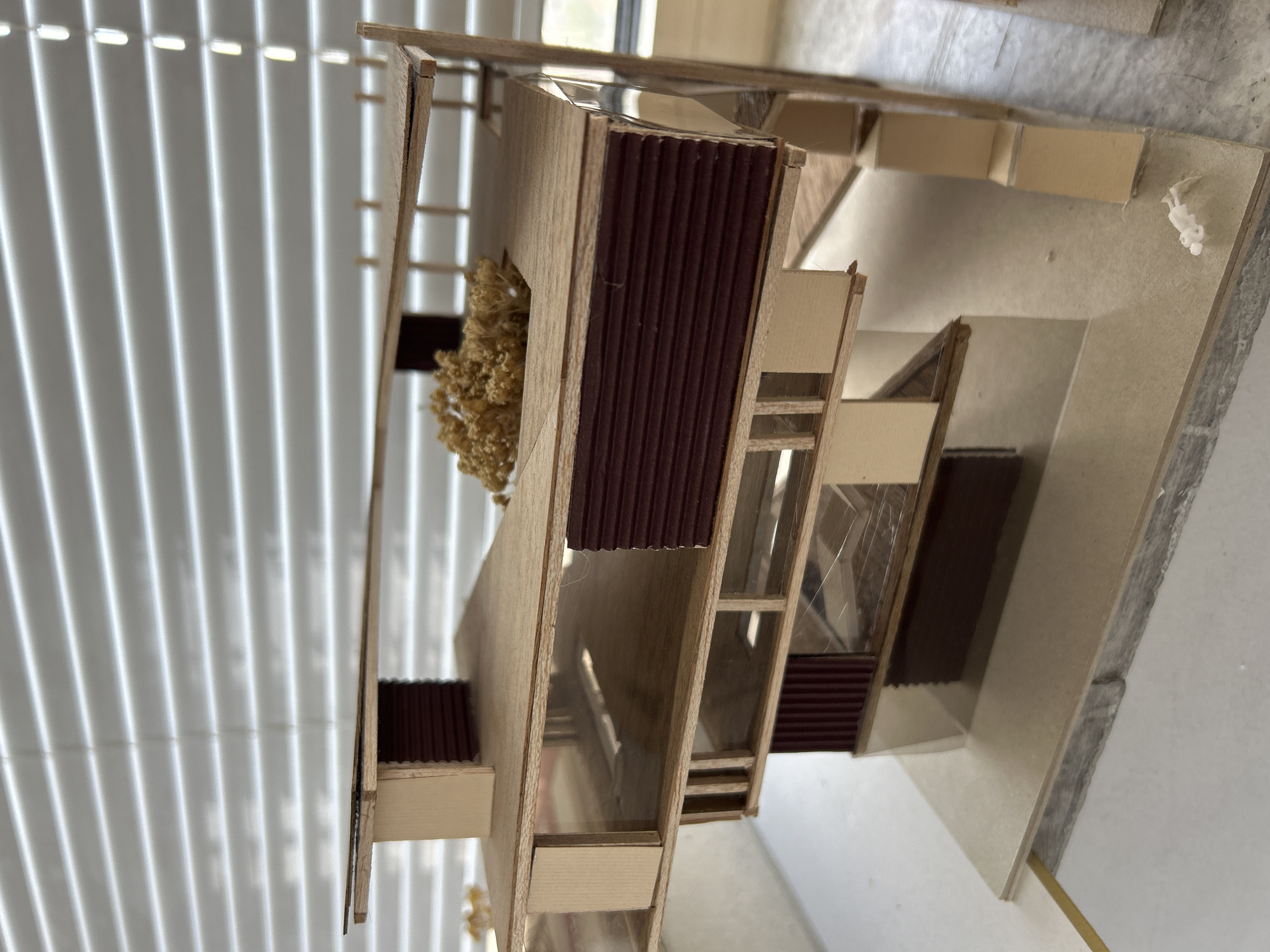Architecture student documents scale models and design work in Sofia