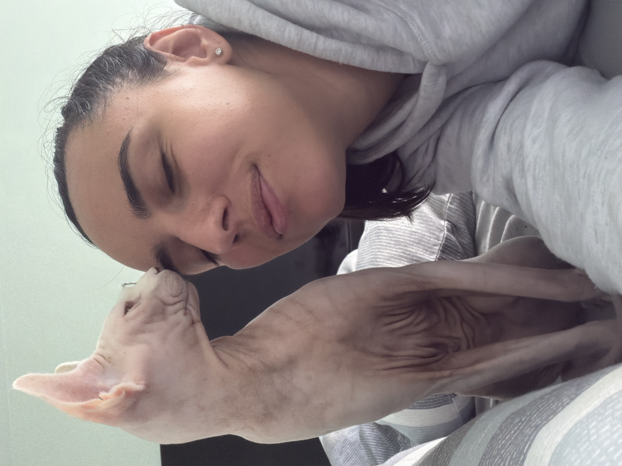 Woman shares tender moments with Sphynx cat in Sofia