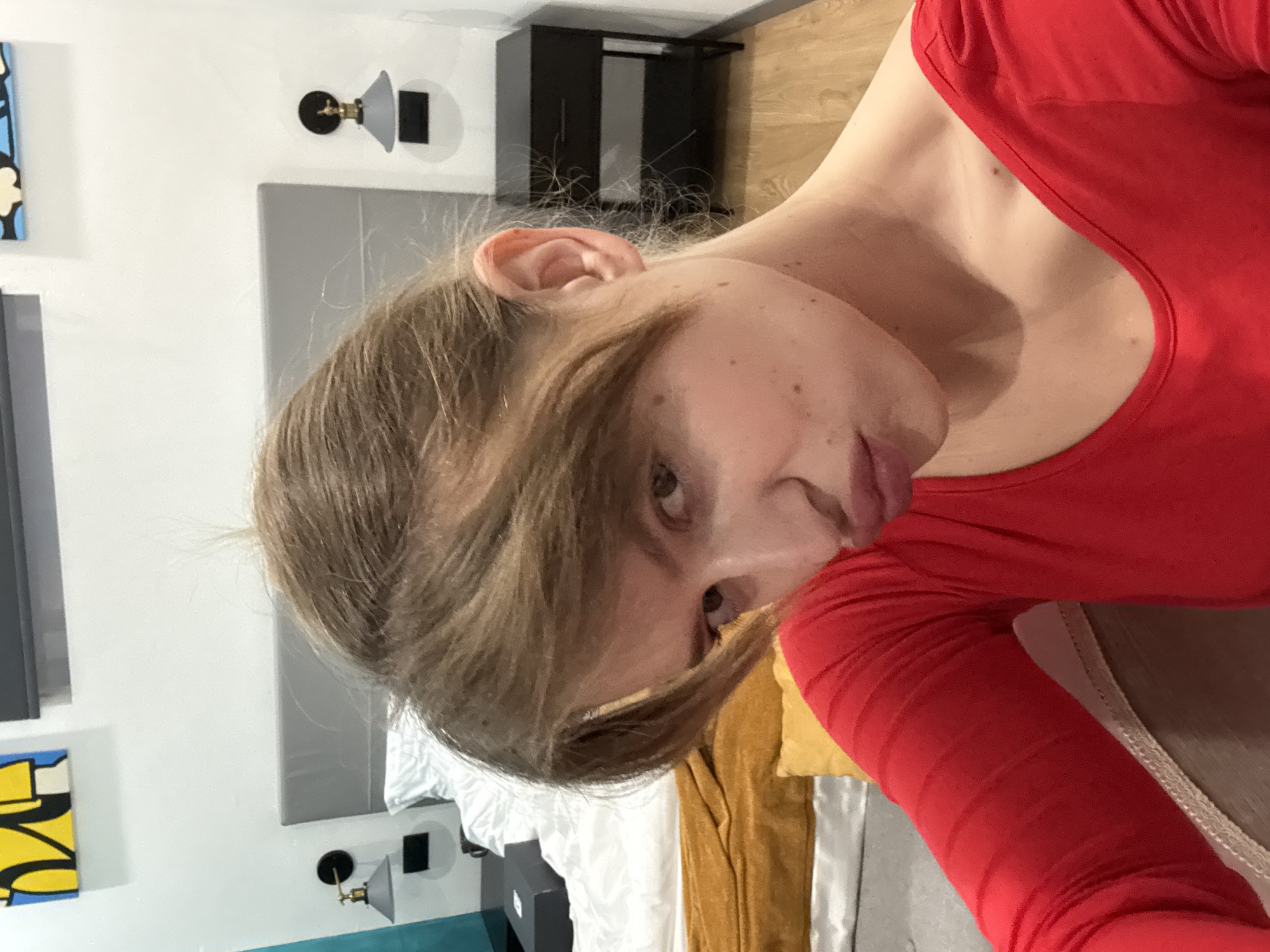 Person takes morning selfie in Crema hotel room