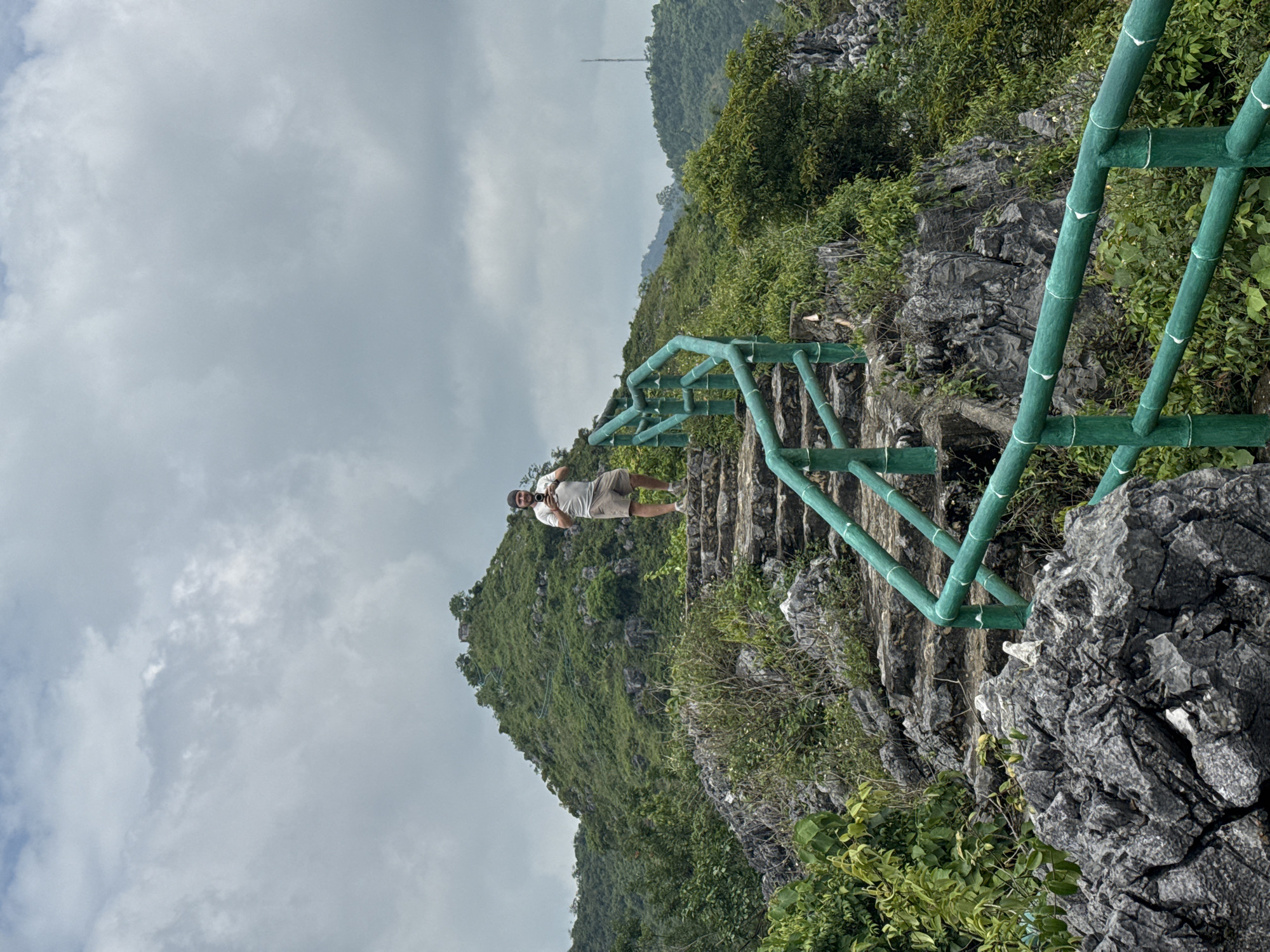 Hiking a hillside ruin above Tam Thanh Ward's rooftops