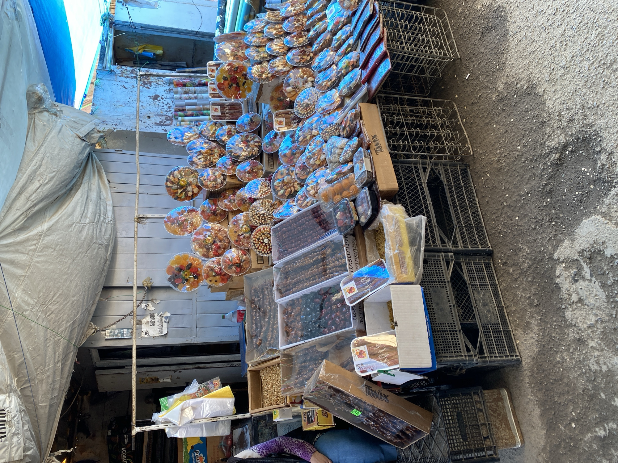 Woman shops for berries at morning market in Gyumri
