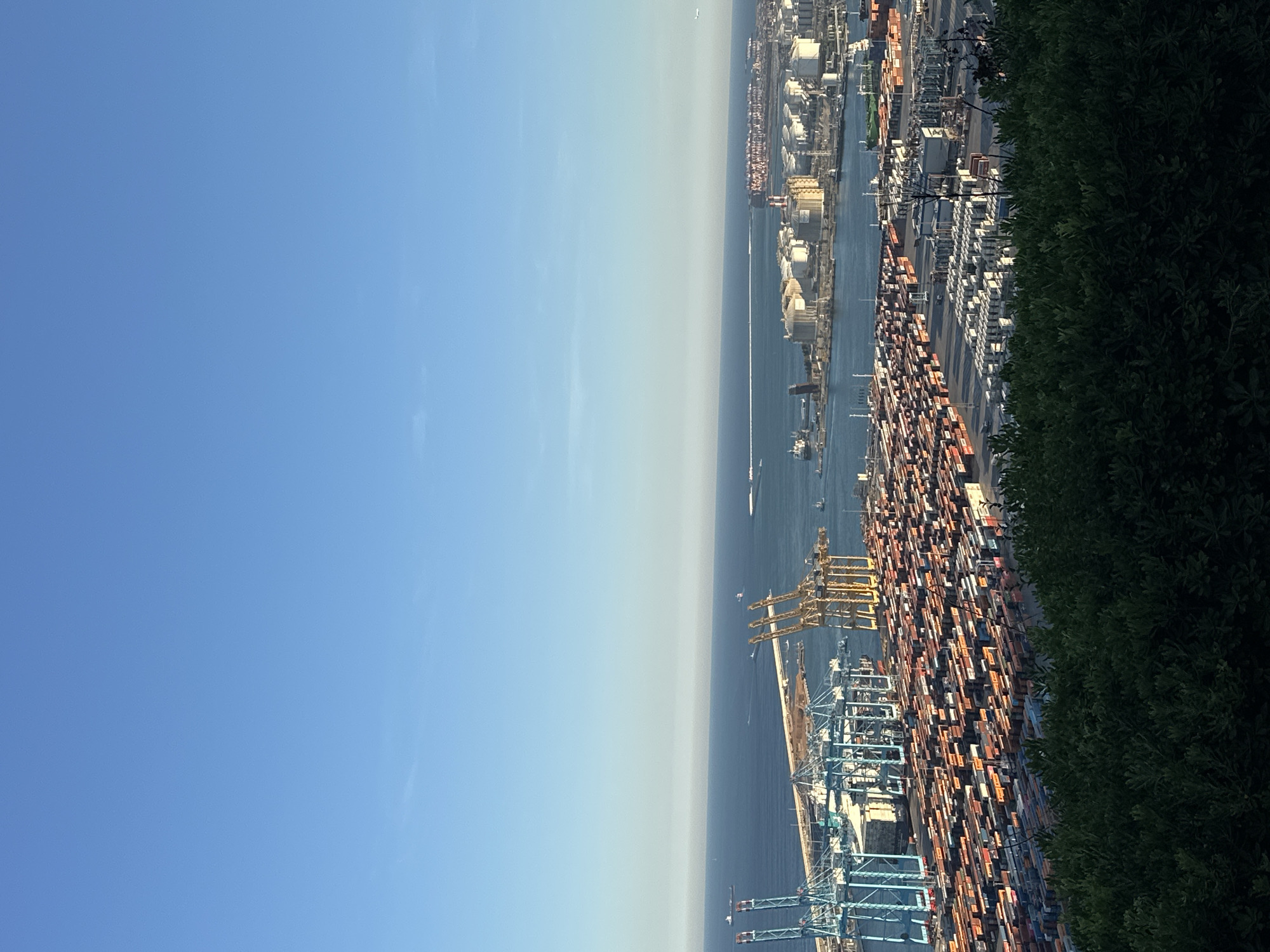 Aerial view captures Barcelona port activity under clear skies