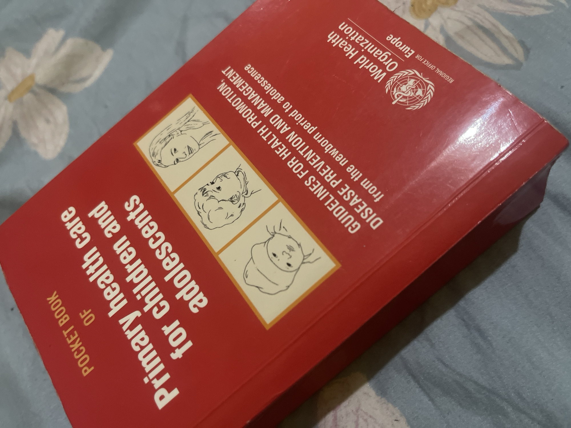 Healthcare worker handles medical guidebook and meal in Dar es Salaam