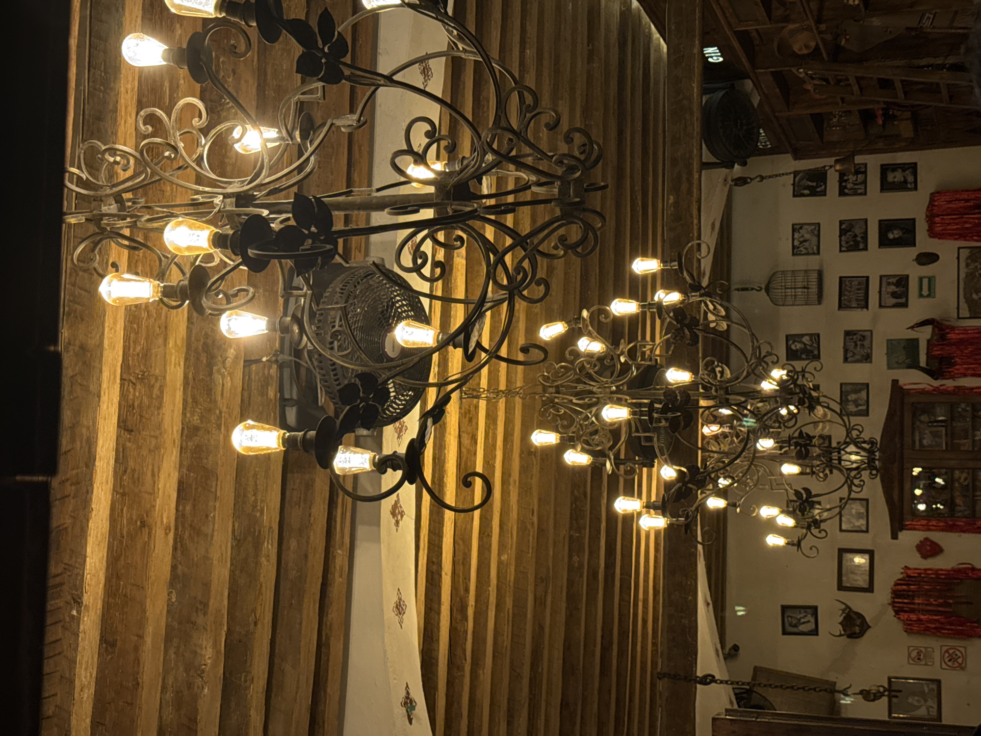 Interior scenes documented at Puebla bar featuring chandeliers, mirrors