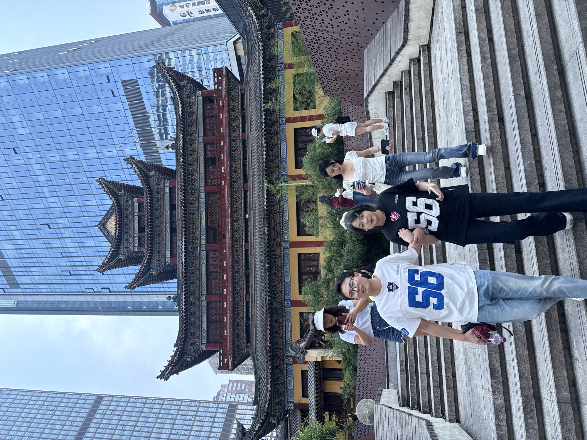 Young people gather on stone steps in Yuzhong District