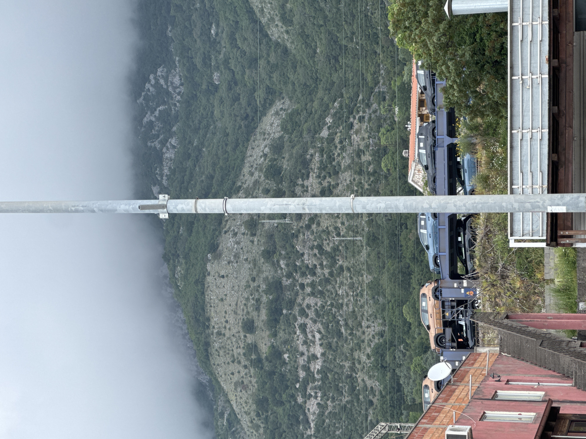 Fog blankets mountain landscape in Miljevci, Montenegro