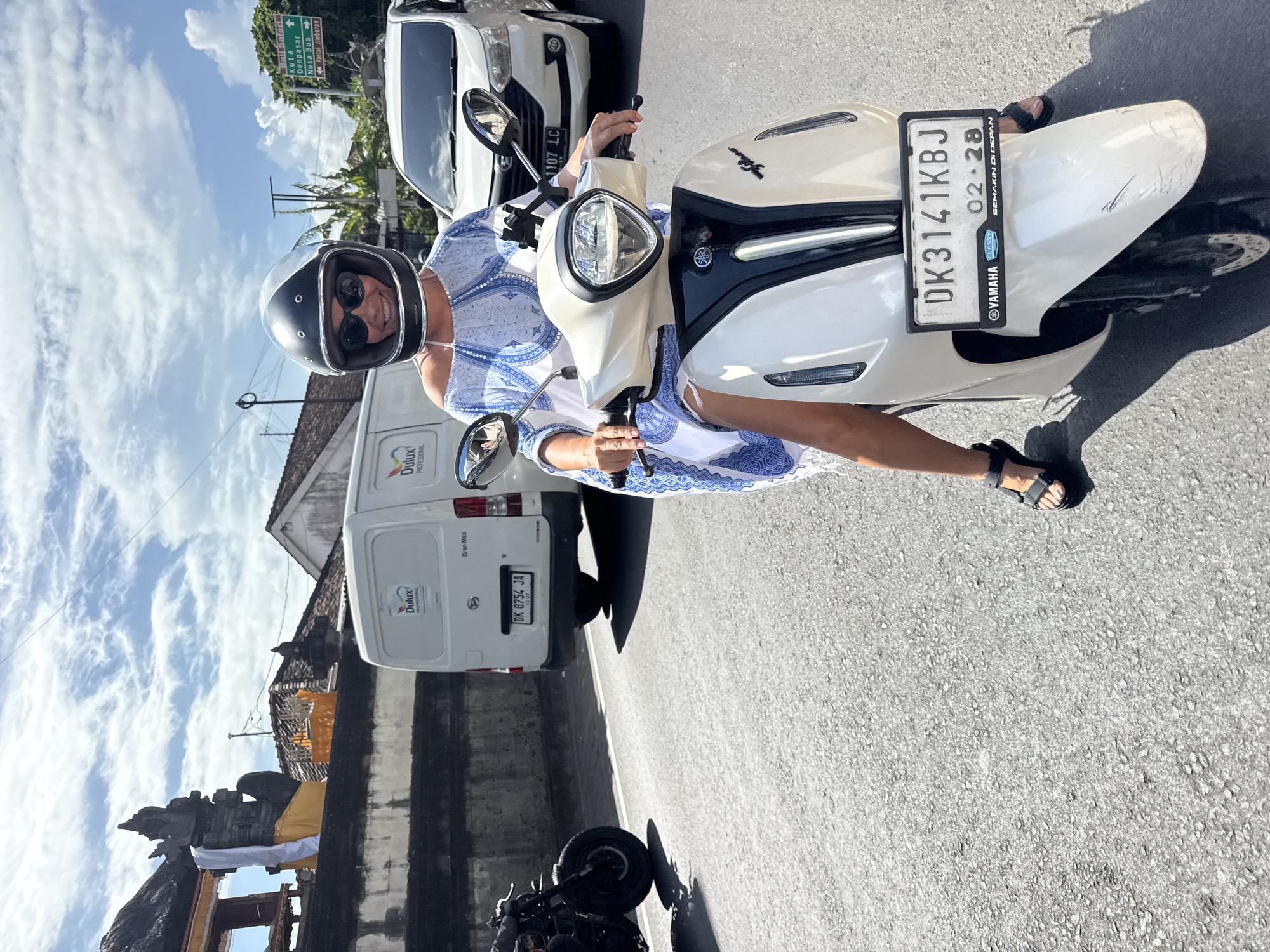 Woman with scooter spotted near Kuta Selatan storefront